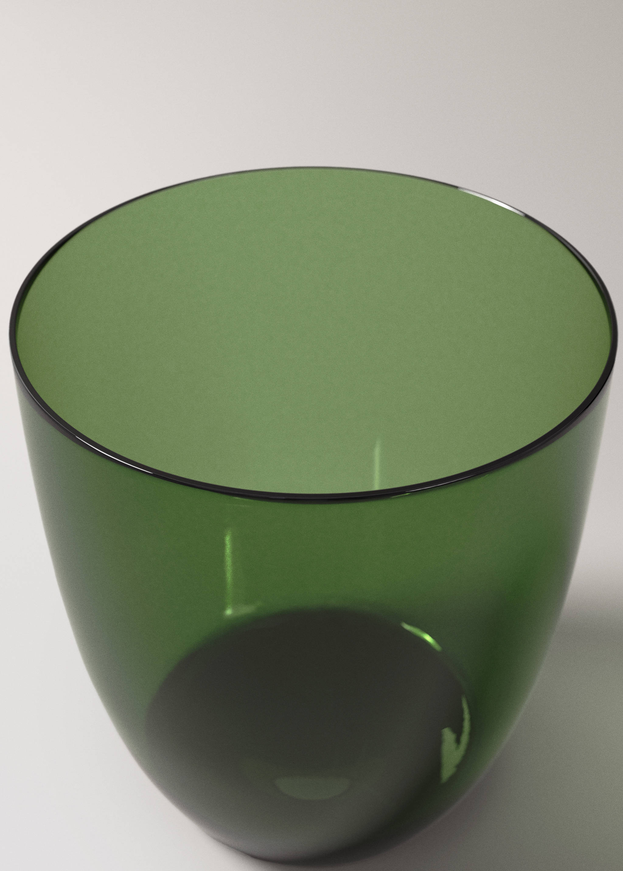 Close-up of a green glass tumbler.