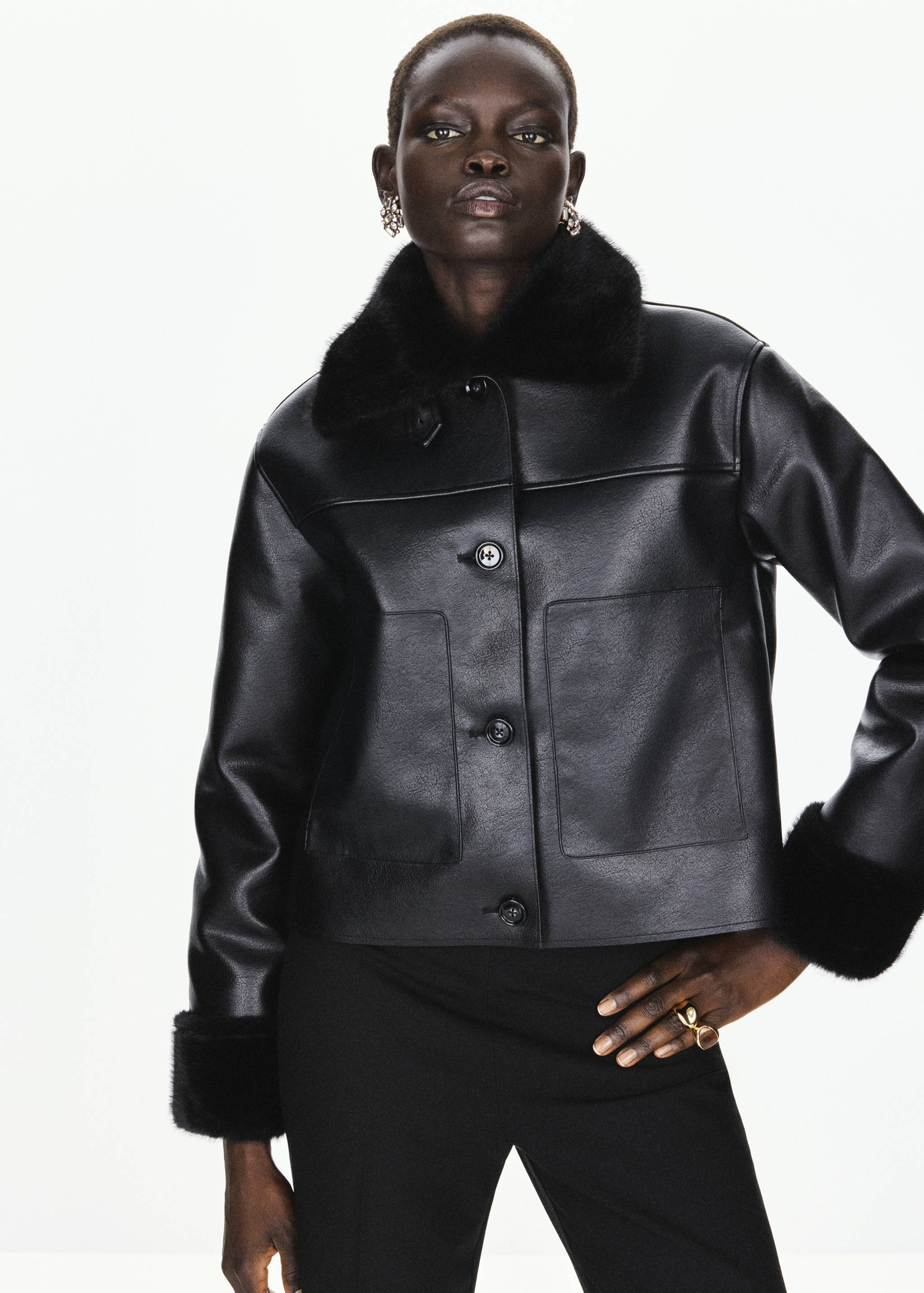 Black cropped jacket with a faux-fur collar and cuffs.