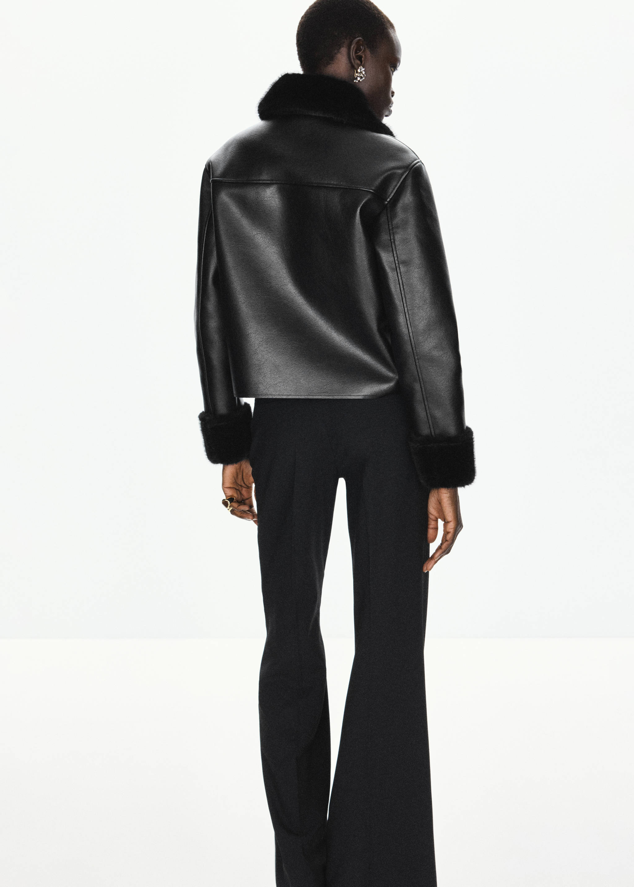 Black jacket with faux-fur collar, shown from the back.