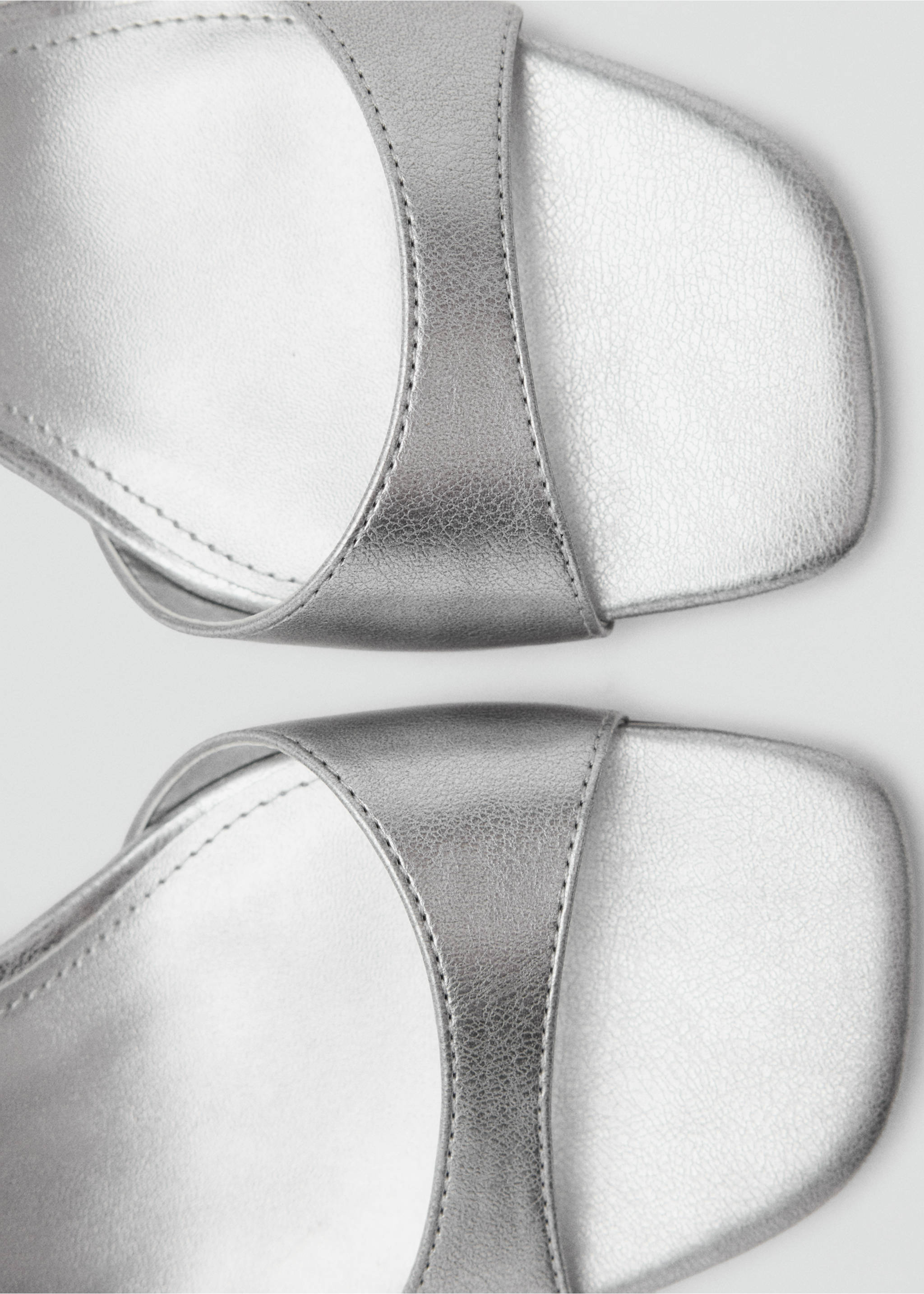 Close-up of metallic silver sandals with a square toe and wide front strap., Silver. Ref: 37067924-00.