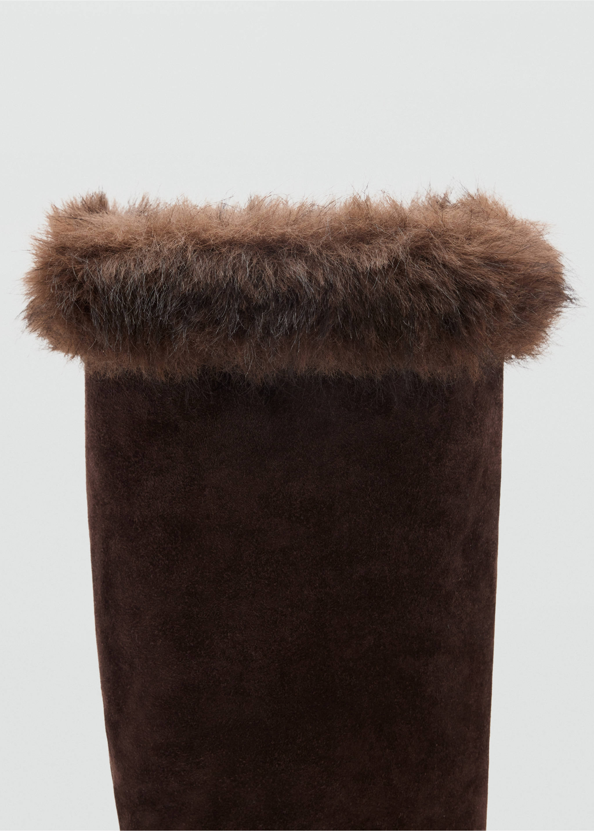 Close-up of a dark brown boot shaft with a fluffy faux-fur cuff., Chocolate. Ref: 37067926-00.