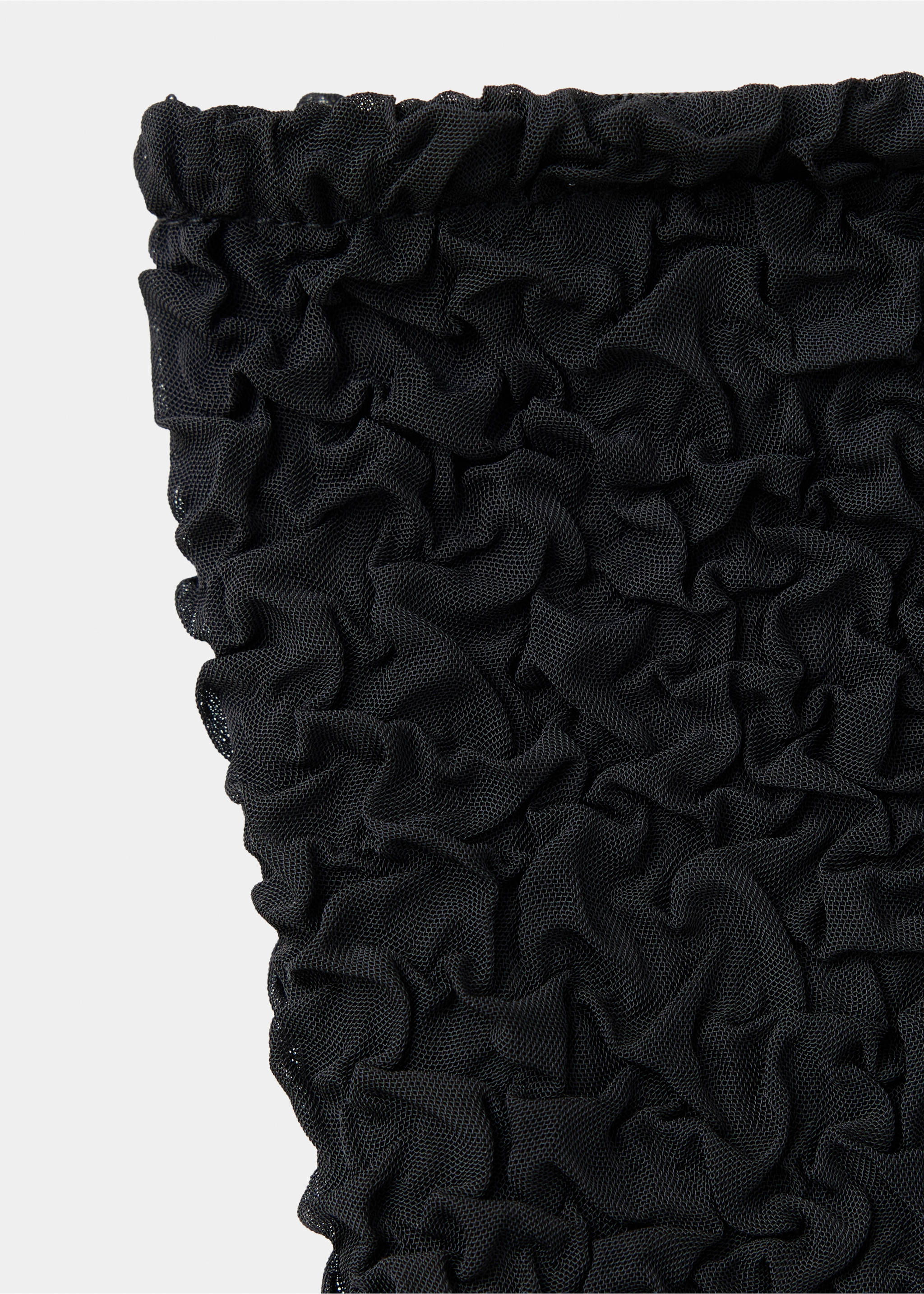 Close-up of black top fabric showing crinkled mesh texture., Black. Ref: 37067929-00.