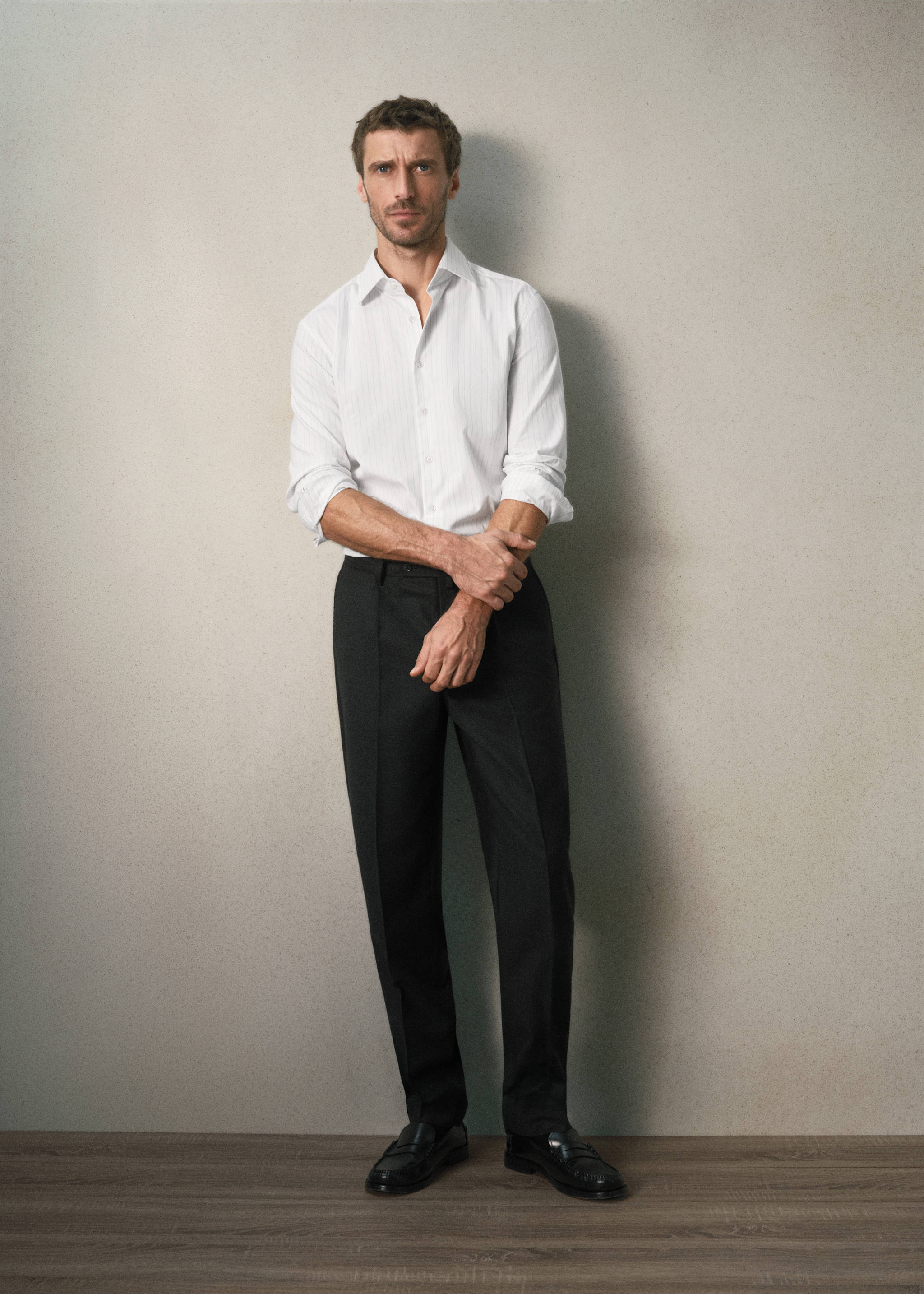 White long-sleeved pinstripe shirt worn with dark trousers., Grey. Ref: 37067938-00.