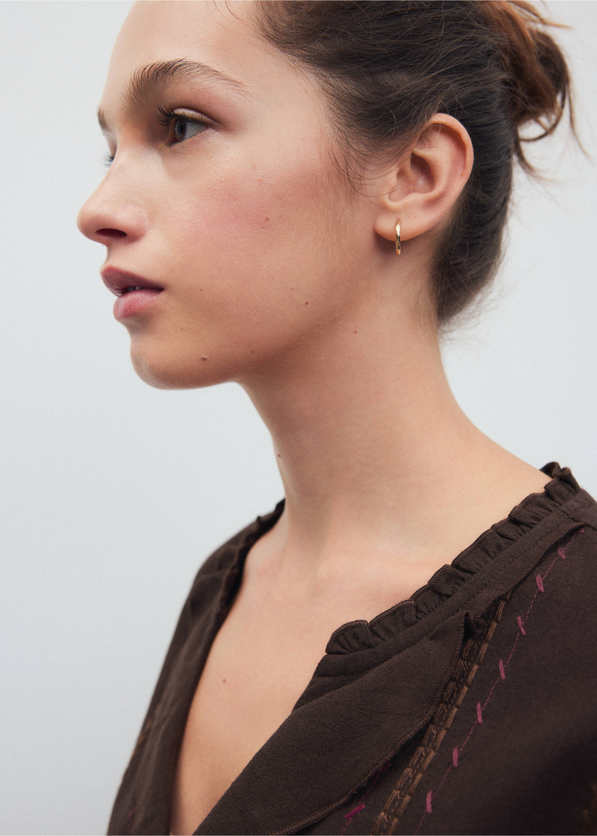 Dark brown shirt with a ruffled V-neck collar and contrasting embroidery detail., Brown. Ref: 37068276-00.