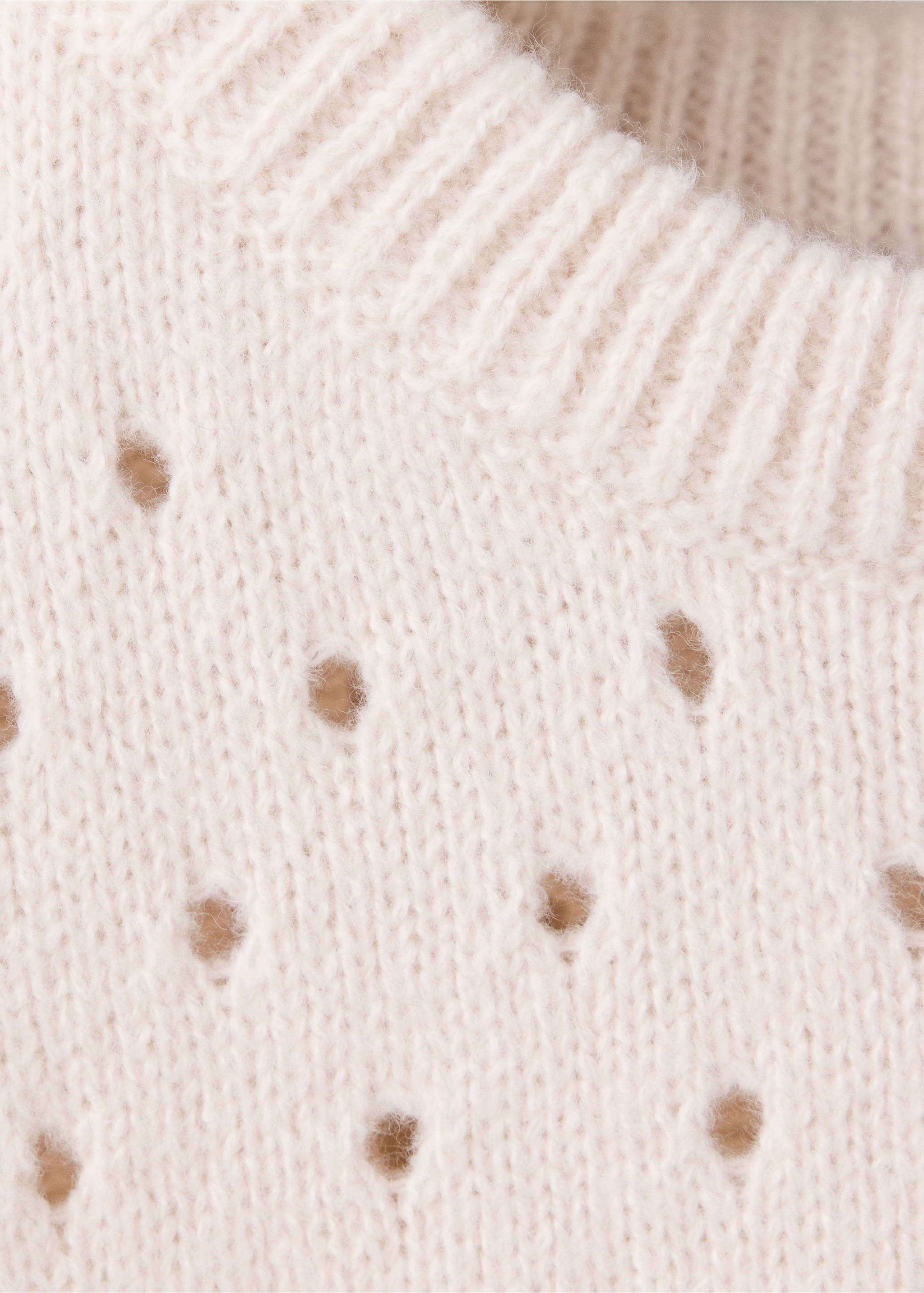 Cream knitted vest fabric detail with ribbed neckline, Ivory White. Ref: 37068277-00.