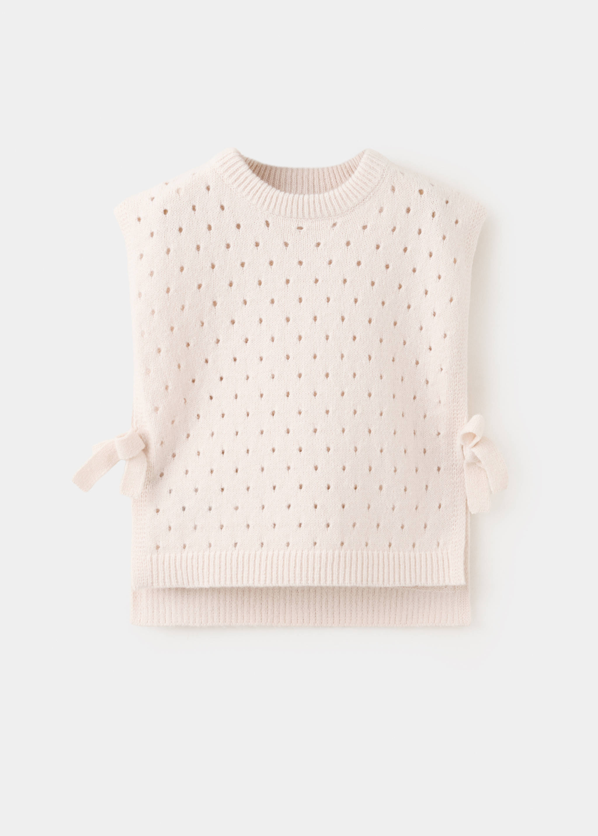 Cream knit pointelle sweater vest with ribbed trim and side ties.