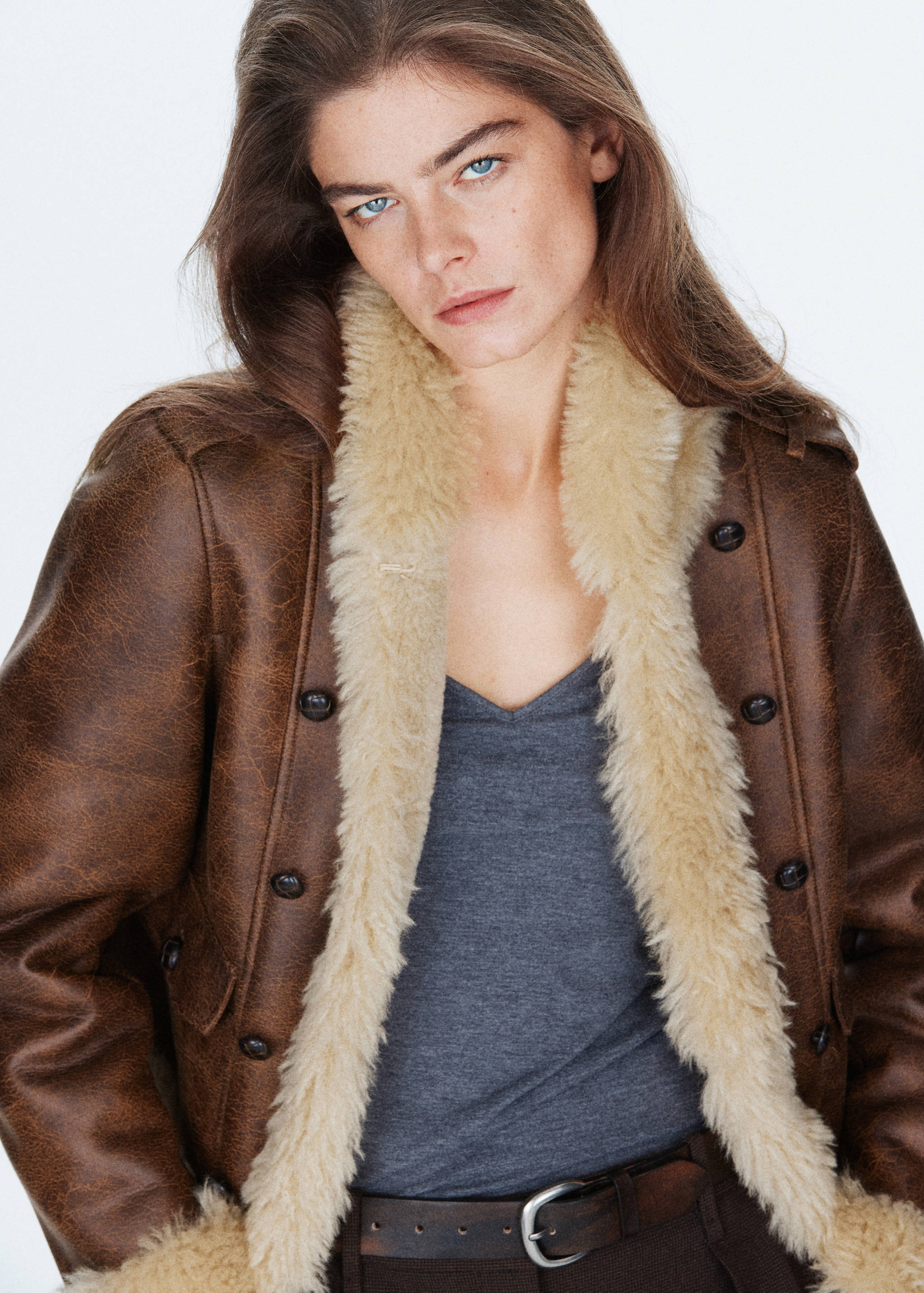 Brown faux-leather jacket with cream faux-shearling lining and lapels.
