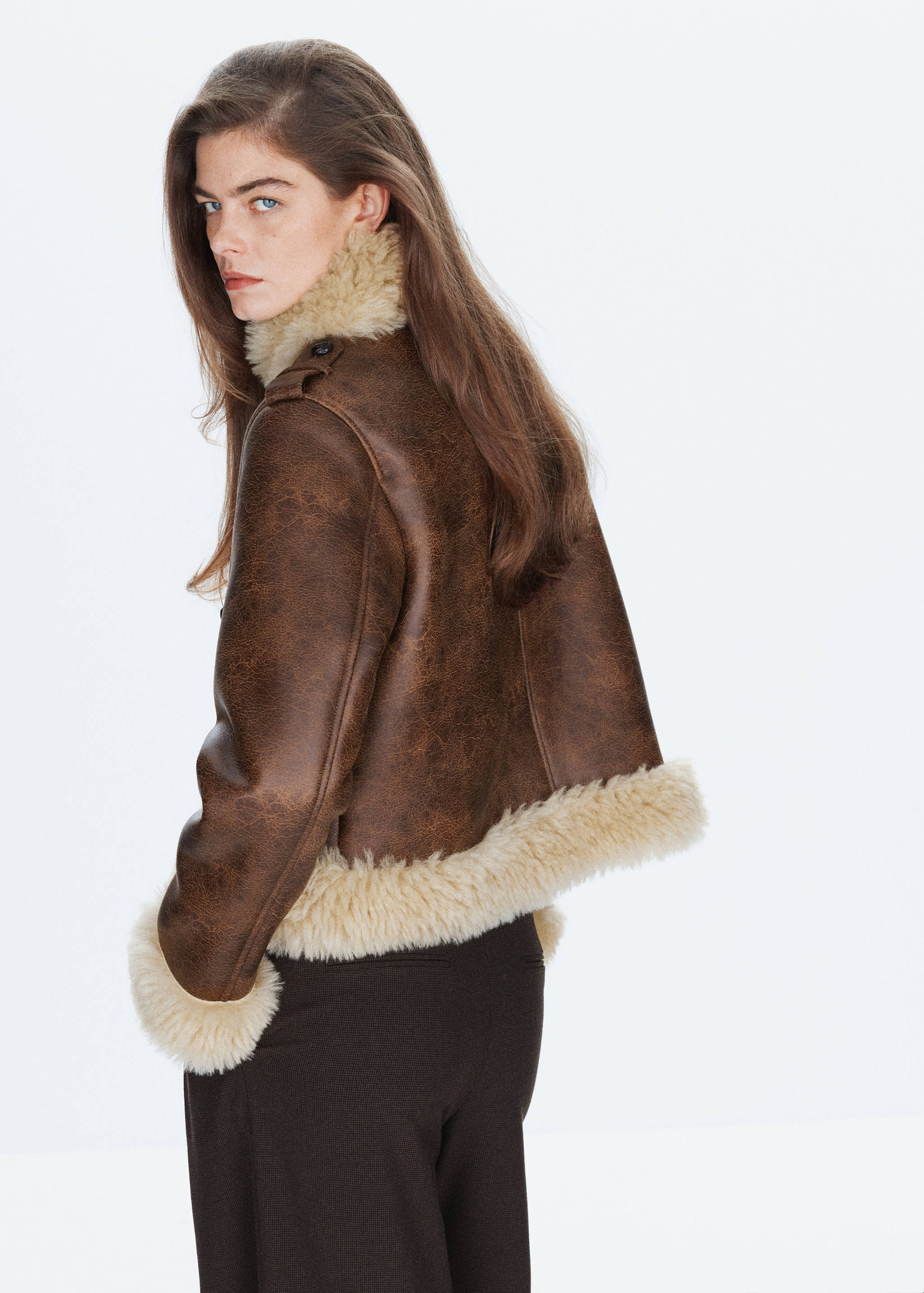 Brown faux-suede jacket with cream faux-shearling trim, back view