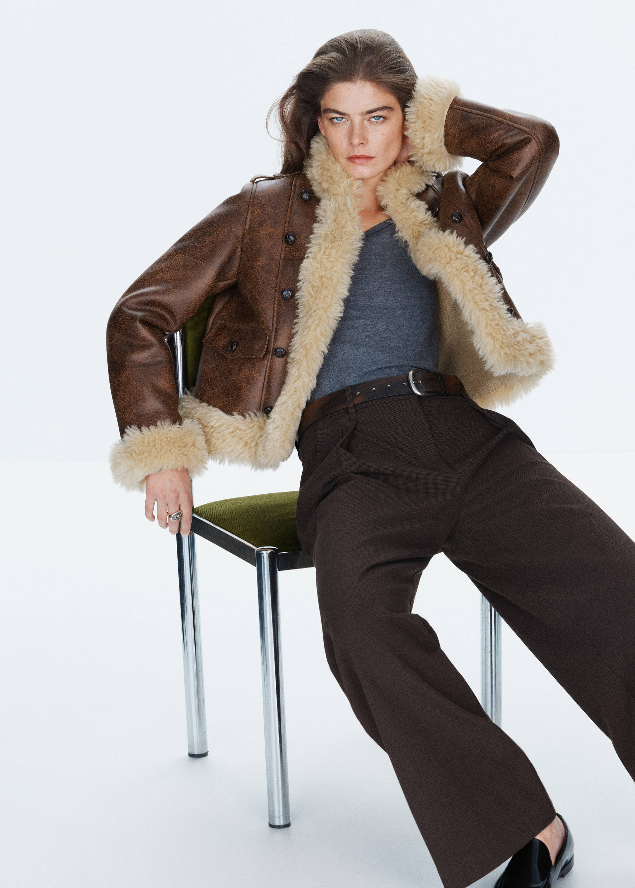 Brown faux-leather jacket with cream faux-shearling trim and lapels.