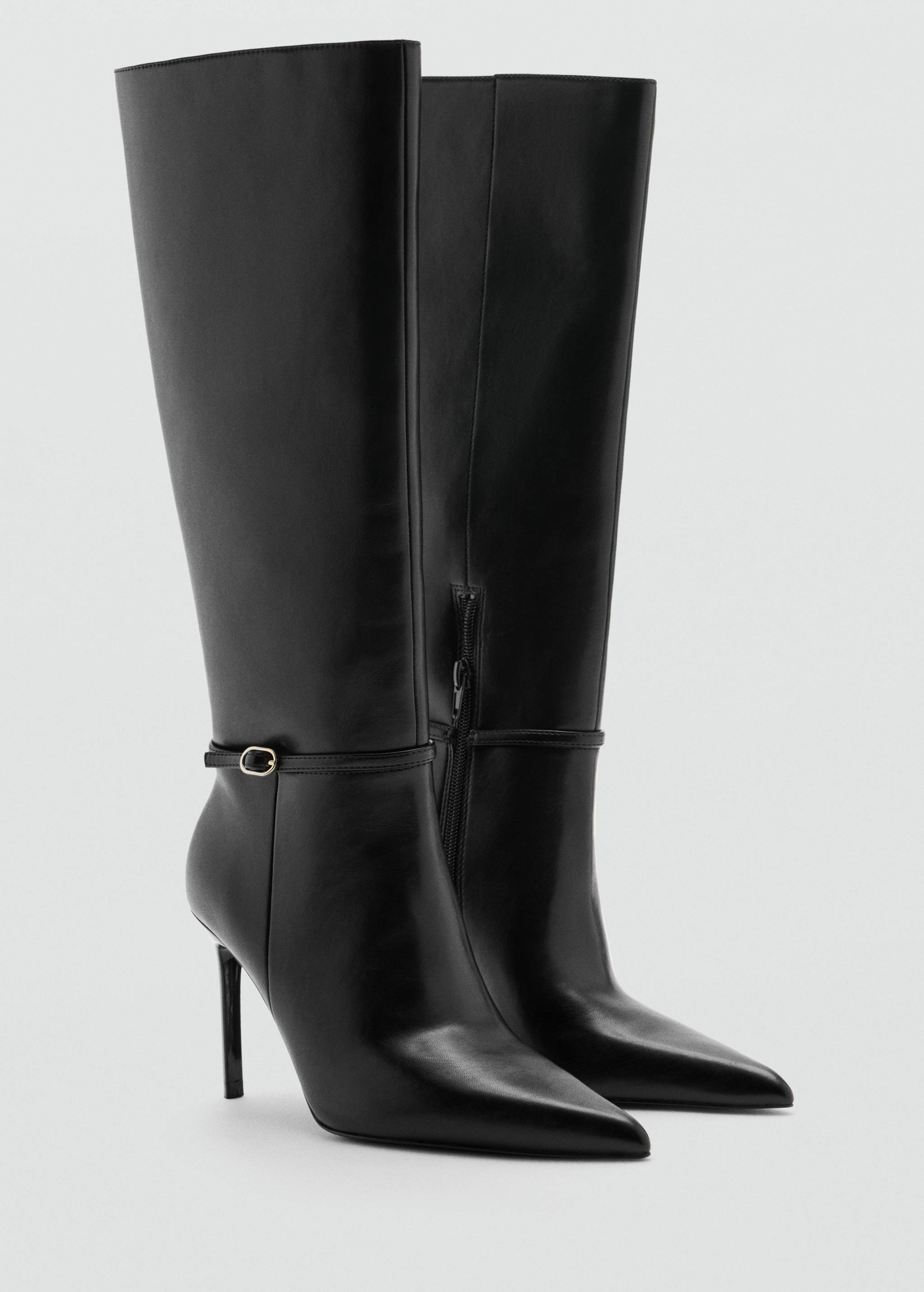 Black leather knee-high boots with pointed toes, stiletto heels, and buckled ankle straps.