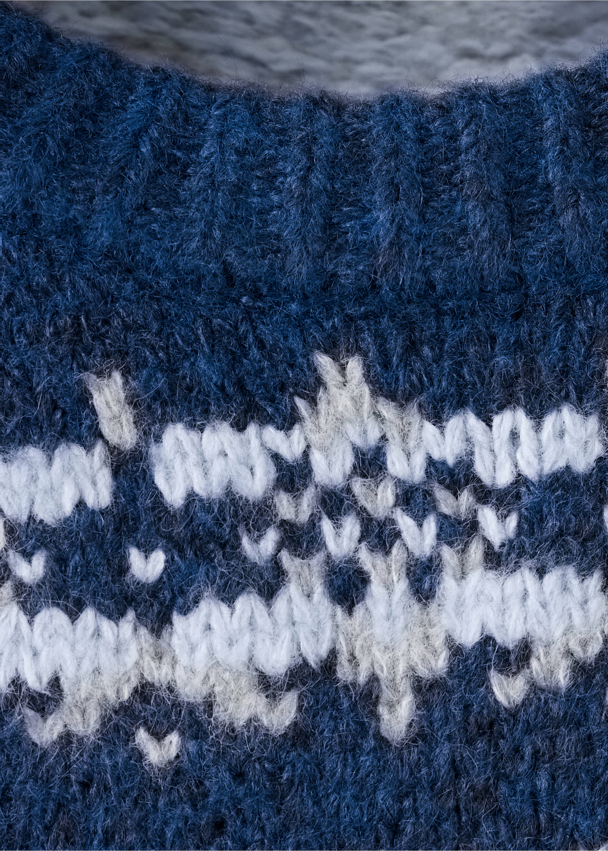 Close-up of a dark blue knitted jumper with a white Nordic pattern., Indigo Blue. Ref: 37068280-00.