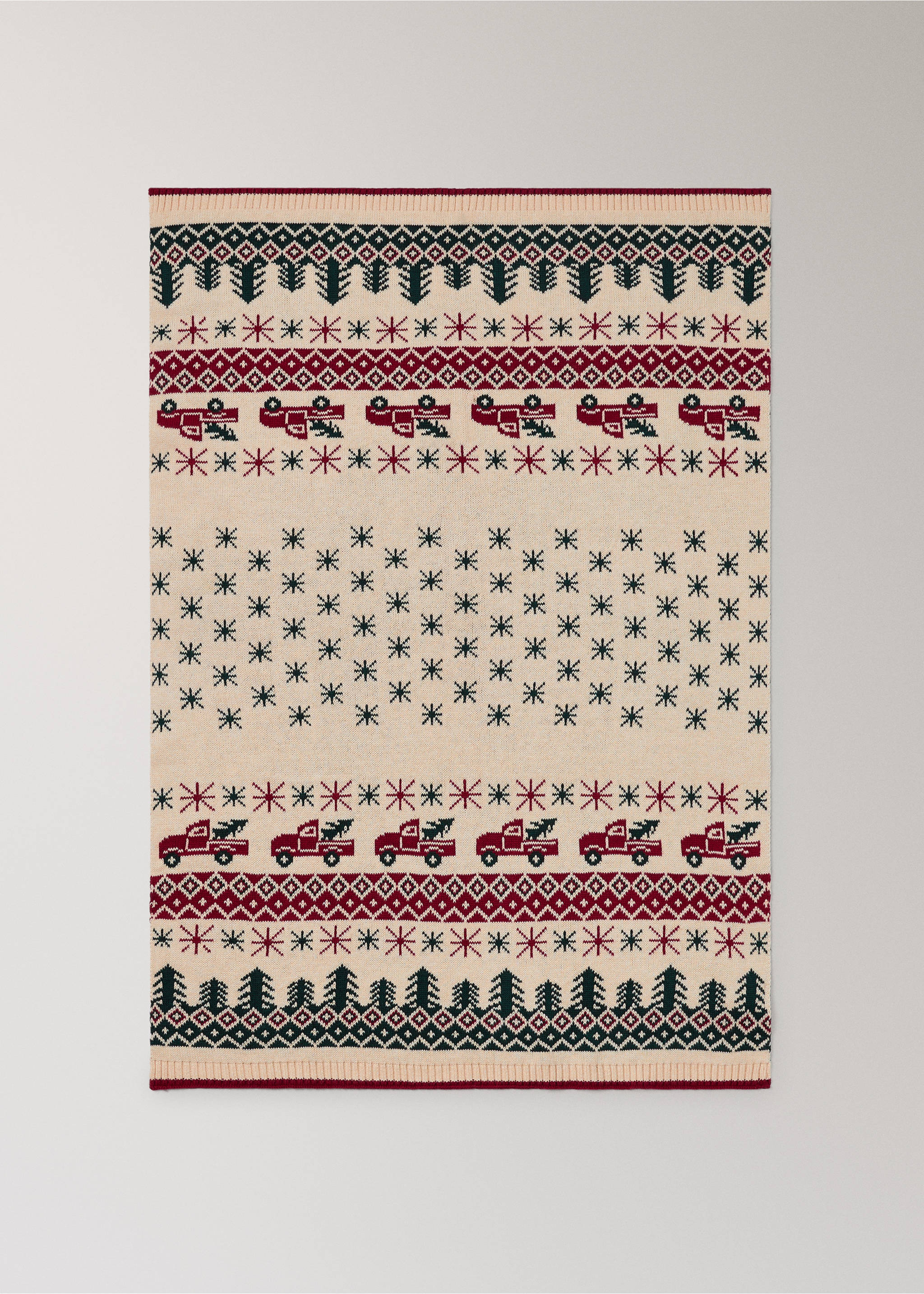 Cream knitted blanket with a festive red and green tree and truck pattern., Red. Ref: 37068630-00.