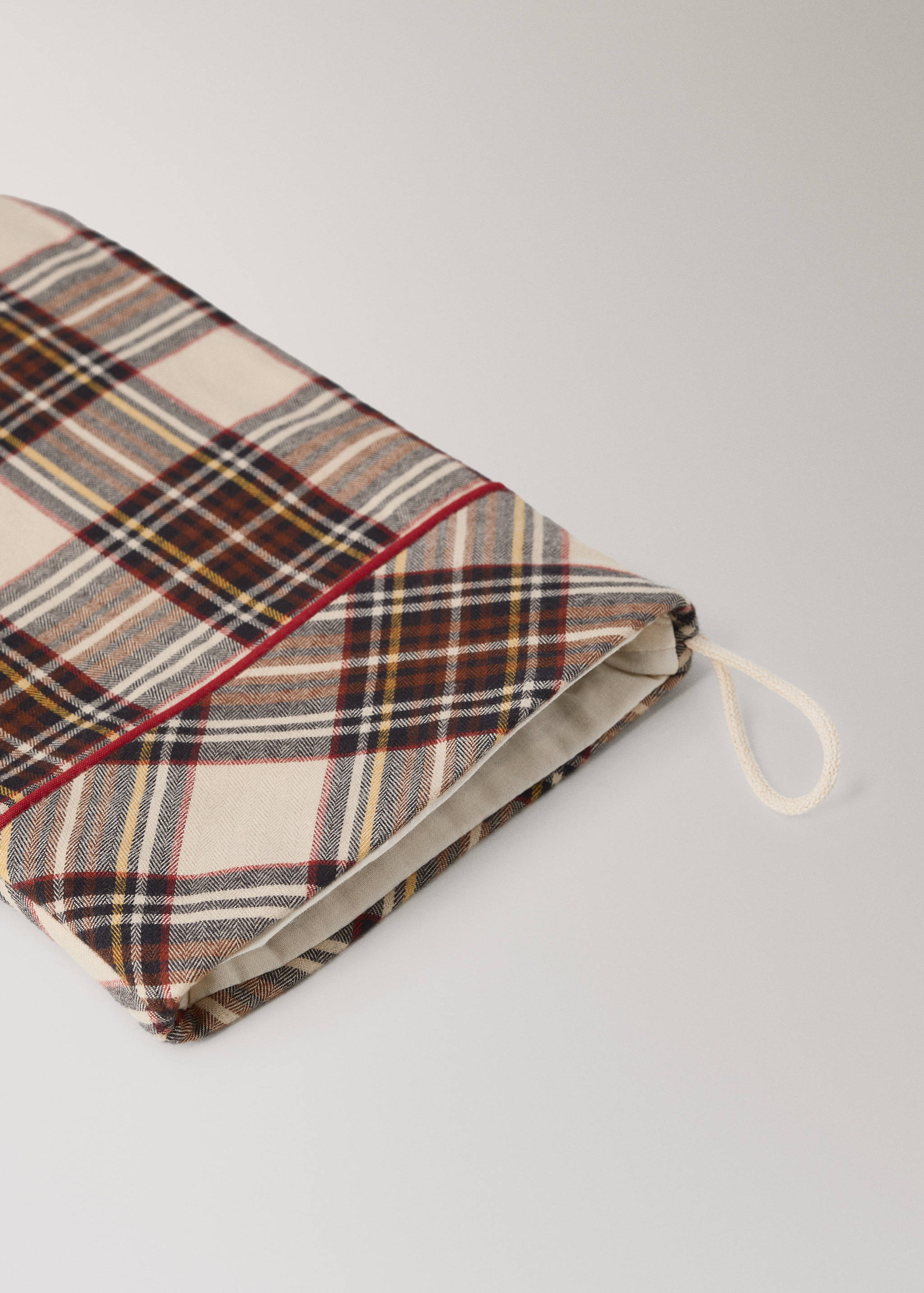 Tartan check Christmas decoration stocking with red piping and a hanging loop.