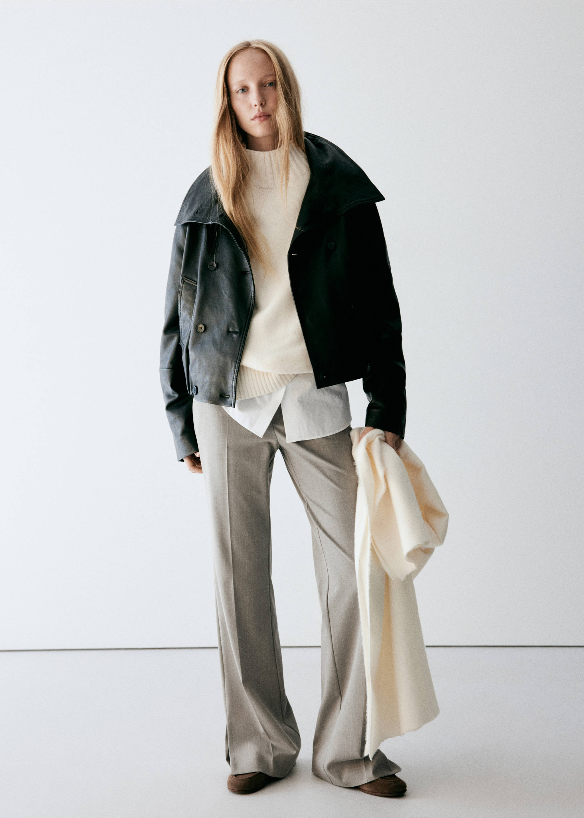 Grey trousers styled with a layered jumper and black leather jacket., Medium Brown. Ref: 37068639-00.