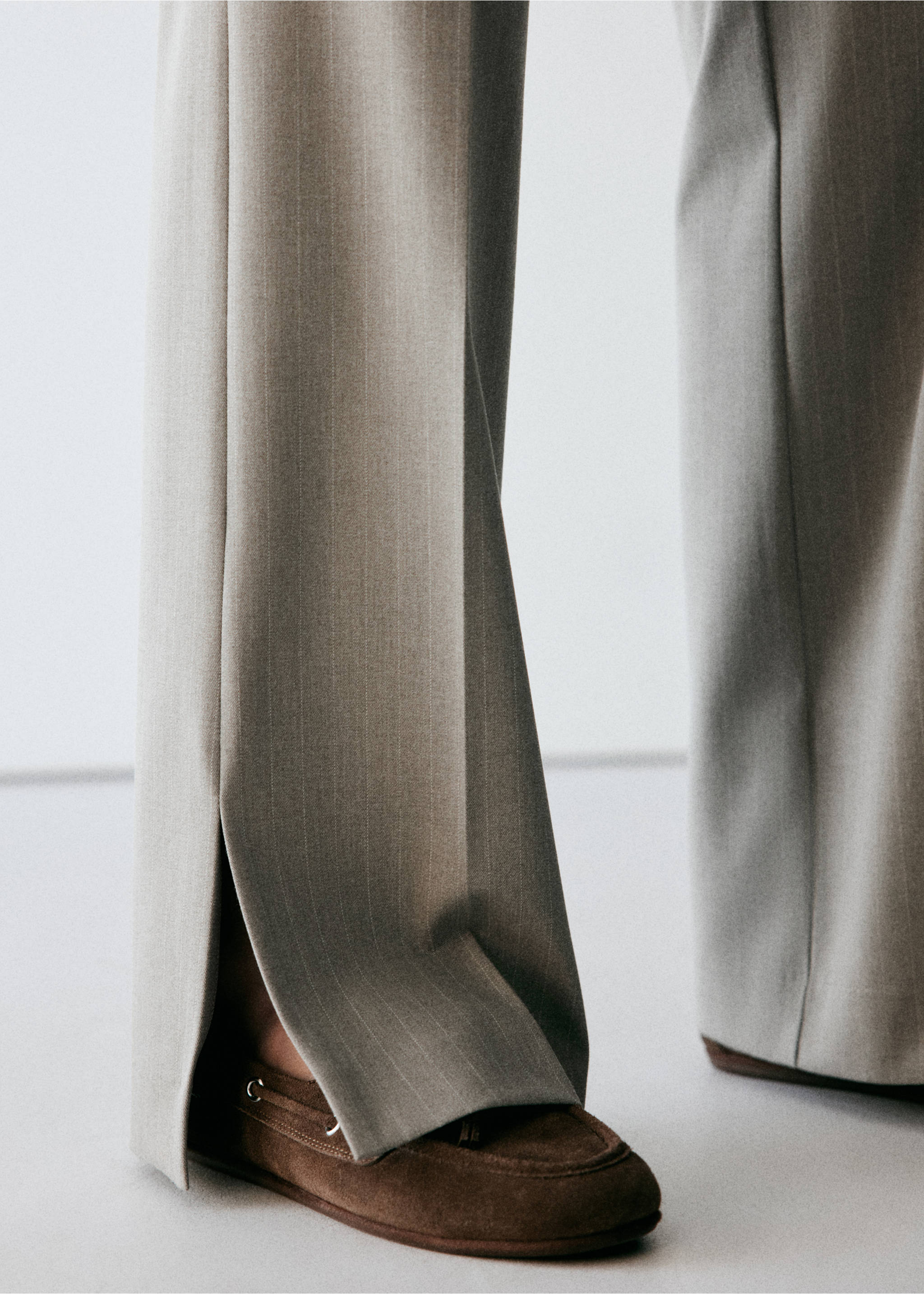 Grey pinstripe trousers with ankle hem splits, worn with brown shoes, Medium Brown. Ref: 37068639-00.