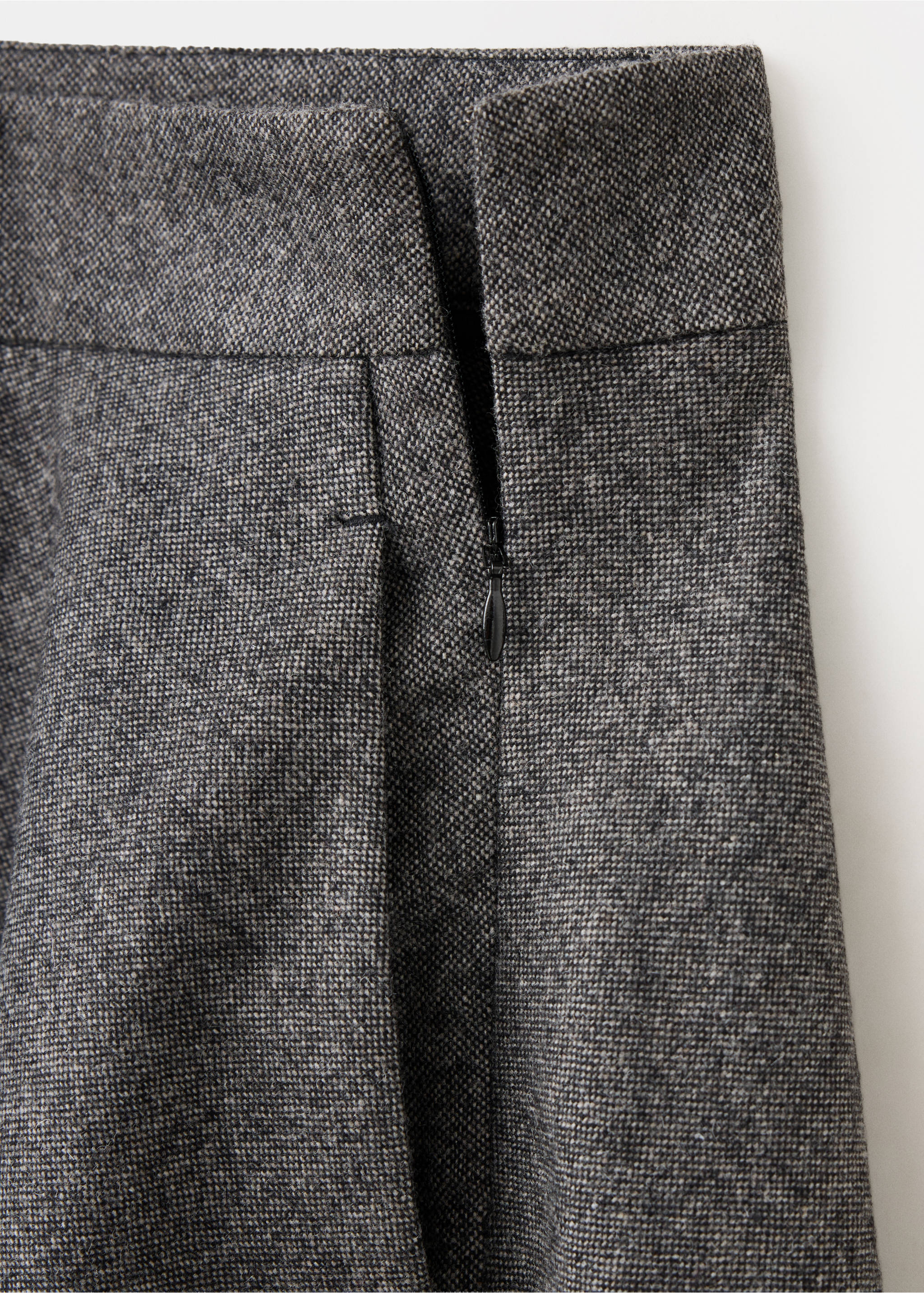 Close-up of a grey tweed skirt showing the waistband and side zip detail., Black. Ref: 37068640-00.