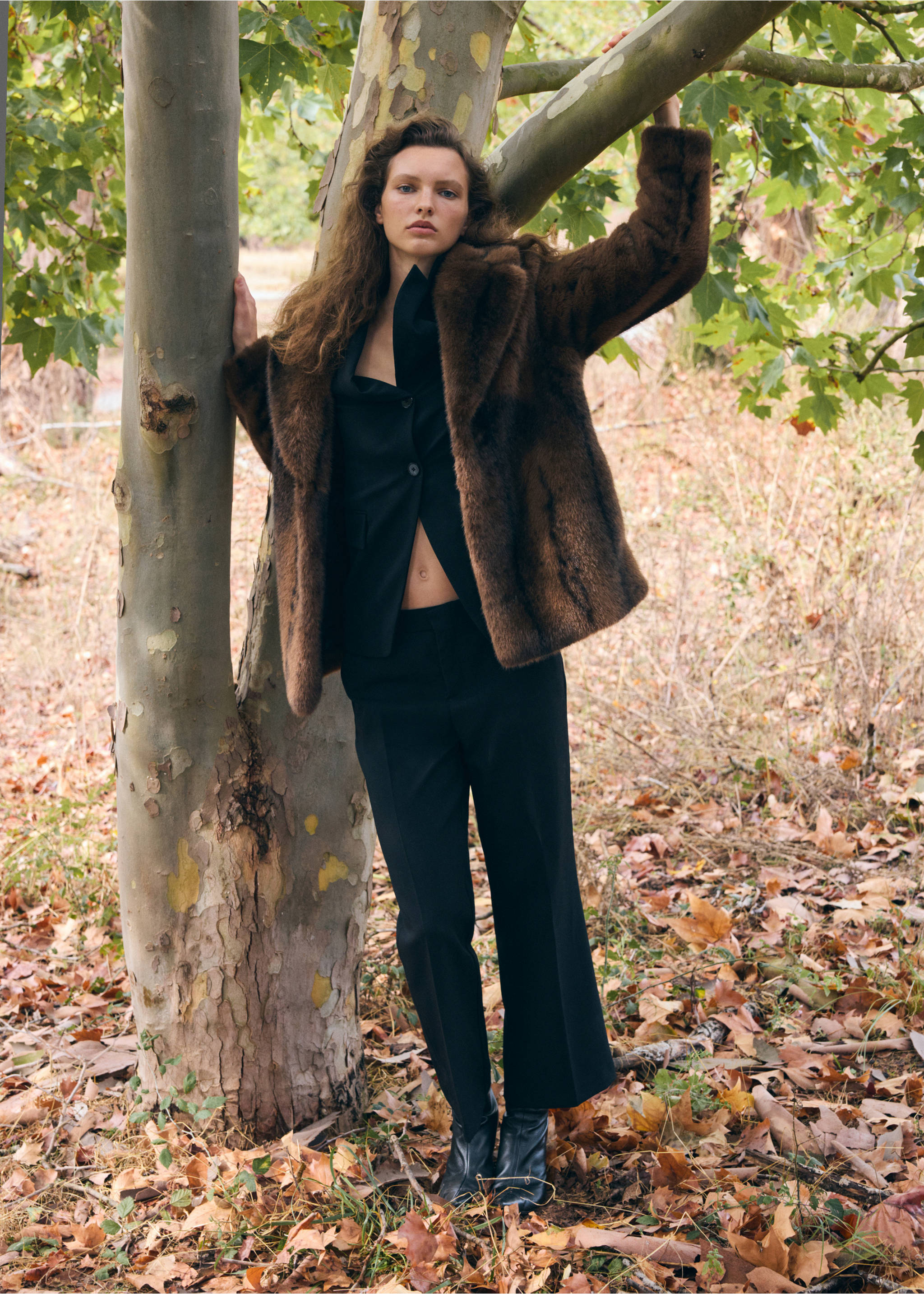 Brown faux-fur coat in a plush texture with wide lapels, worn with a black top and trousers., Brown. Ref: 37069113-00.