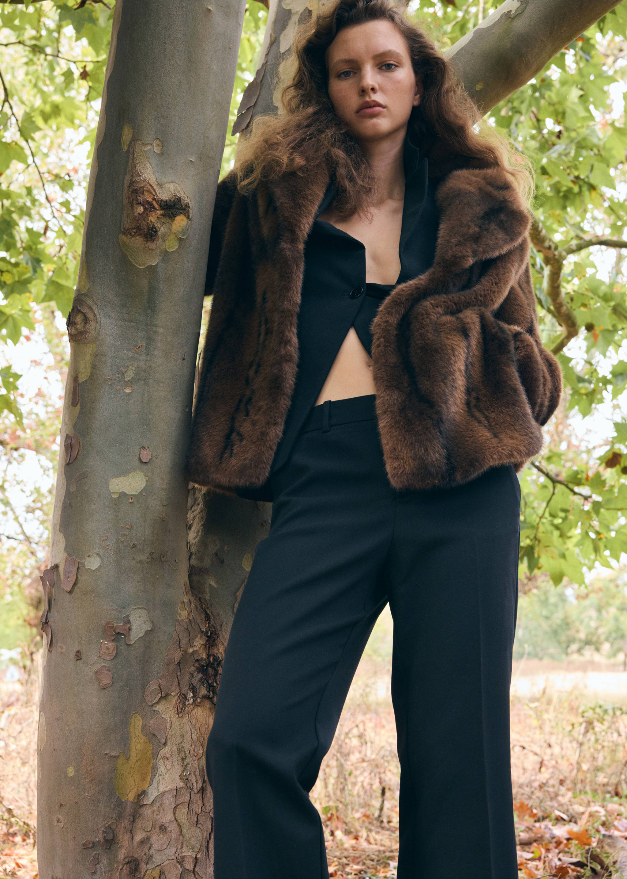 Brown faux-fur coat worn outdoors in a park setting., Brown. Ref: 37069113-00.