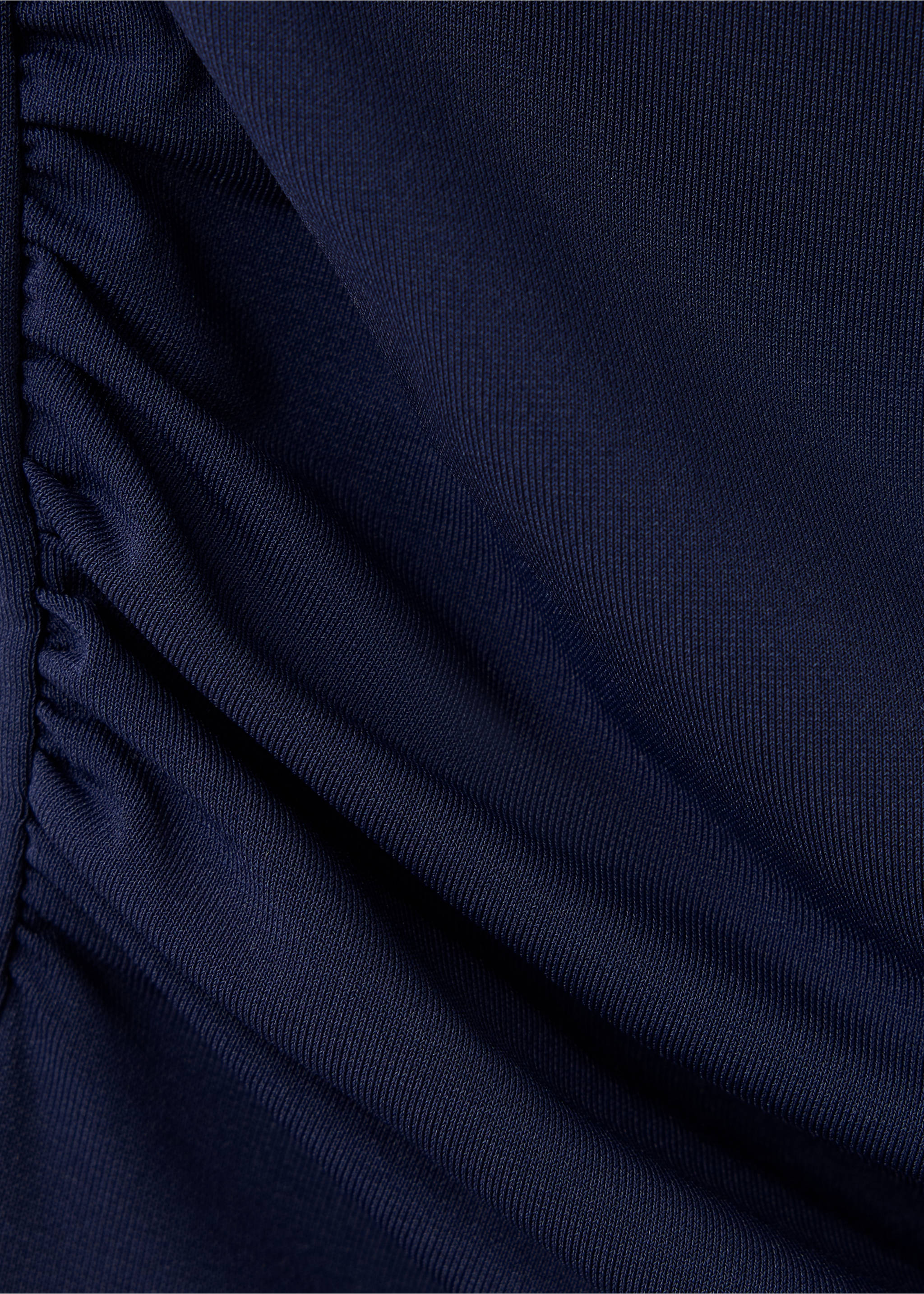 Close-up of navy blue ribbed top fabric with side gathers., Navy. Ref: 37069118-00.