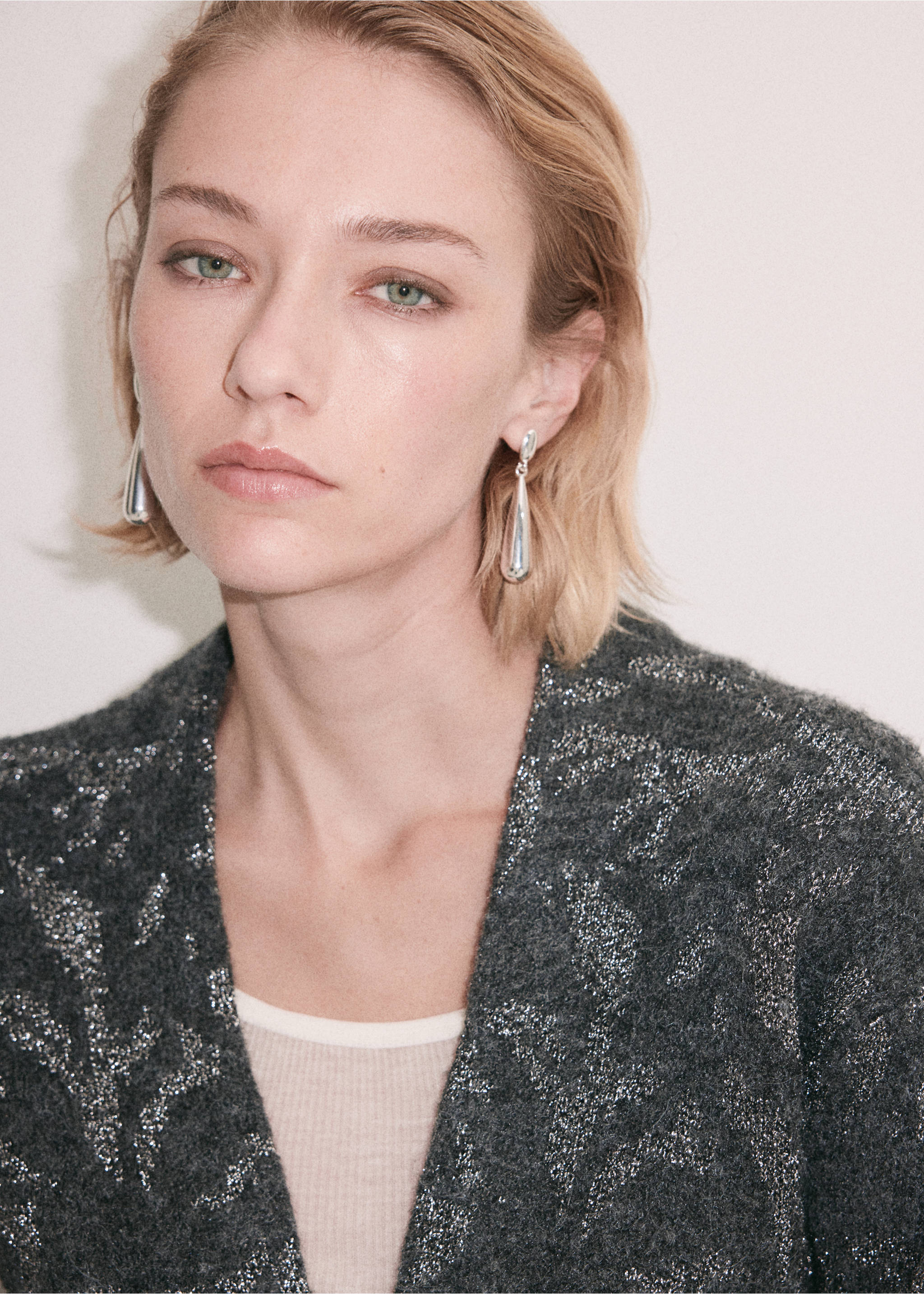 Dark grey V-neck jacket with a shimmering metallic silver pattern., Charcoal. Ref: 37069121-00.