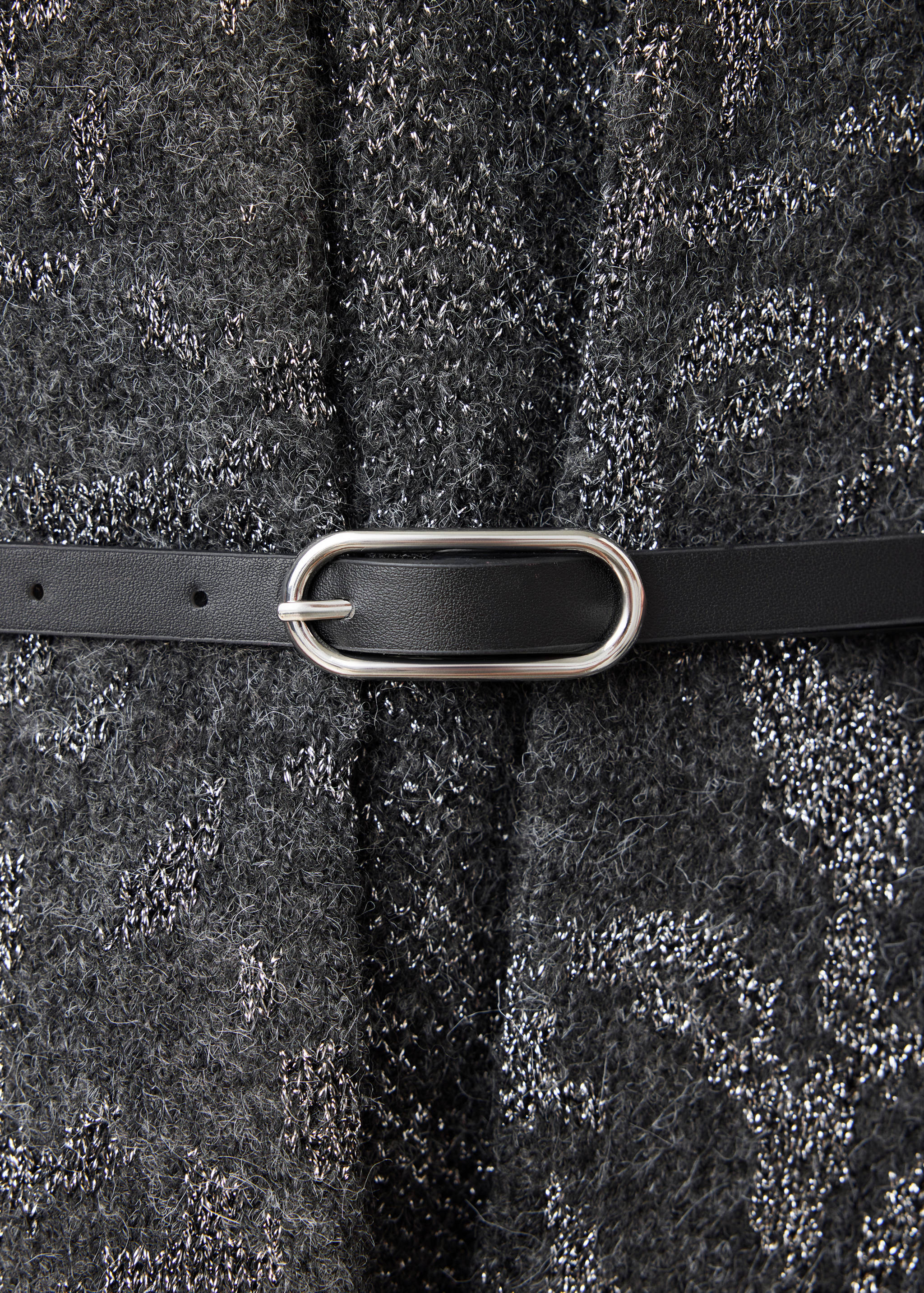 Grey metallic jacket detailed with a thin black belt and oval buckle.