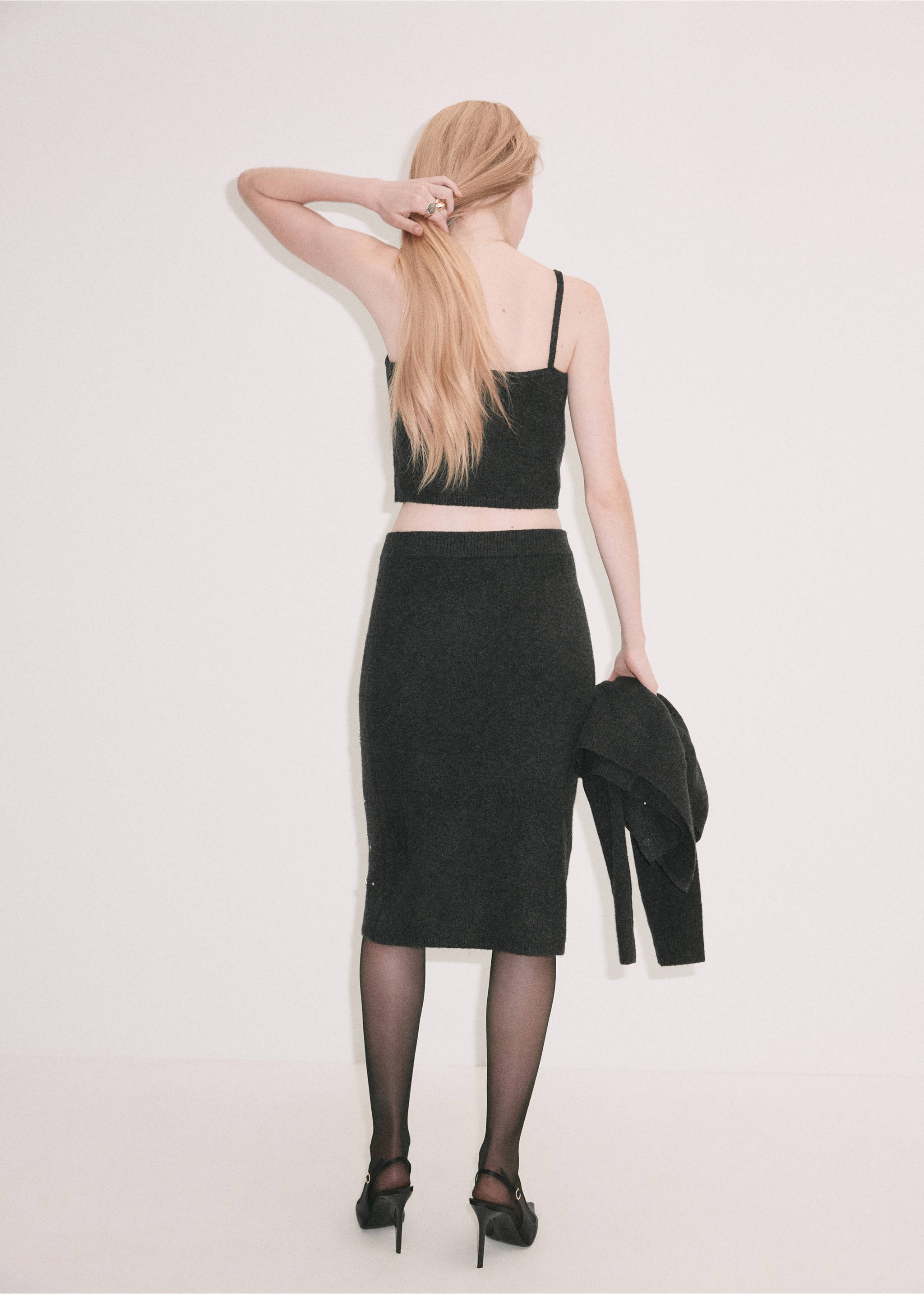 Dark grey knitted crop top from the back, worn with a matching skirt., Charcoal. Ref: 37069125-00.
