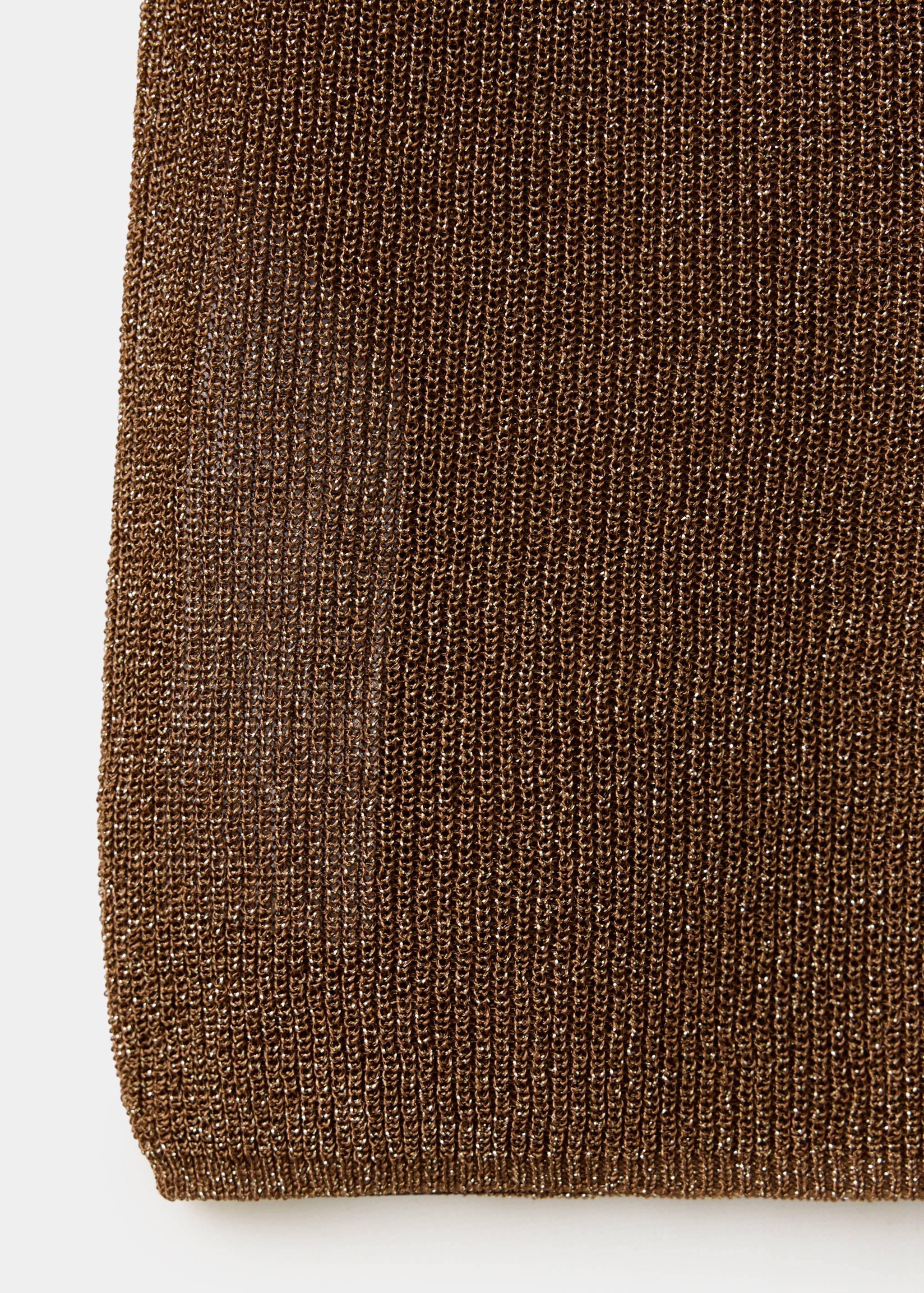 Close-up of the brown metallic knit fabric texture of a top.