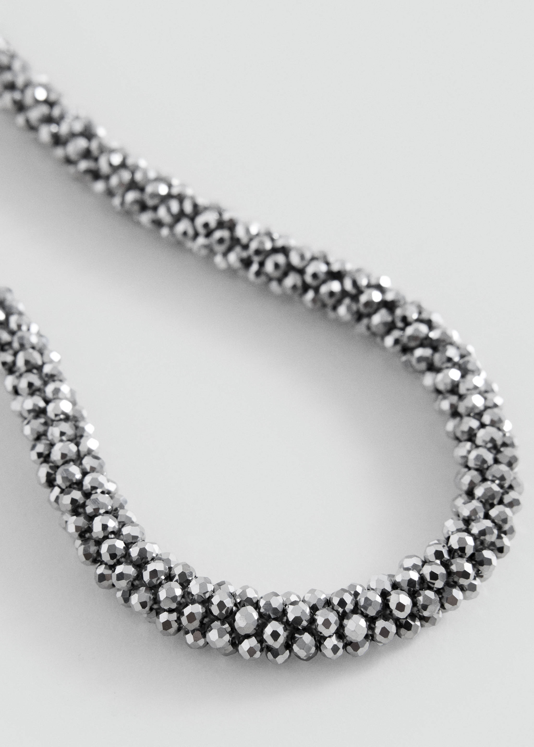 Silver beaded collar necklace.
