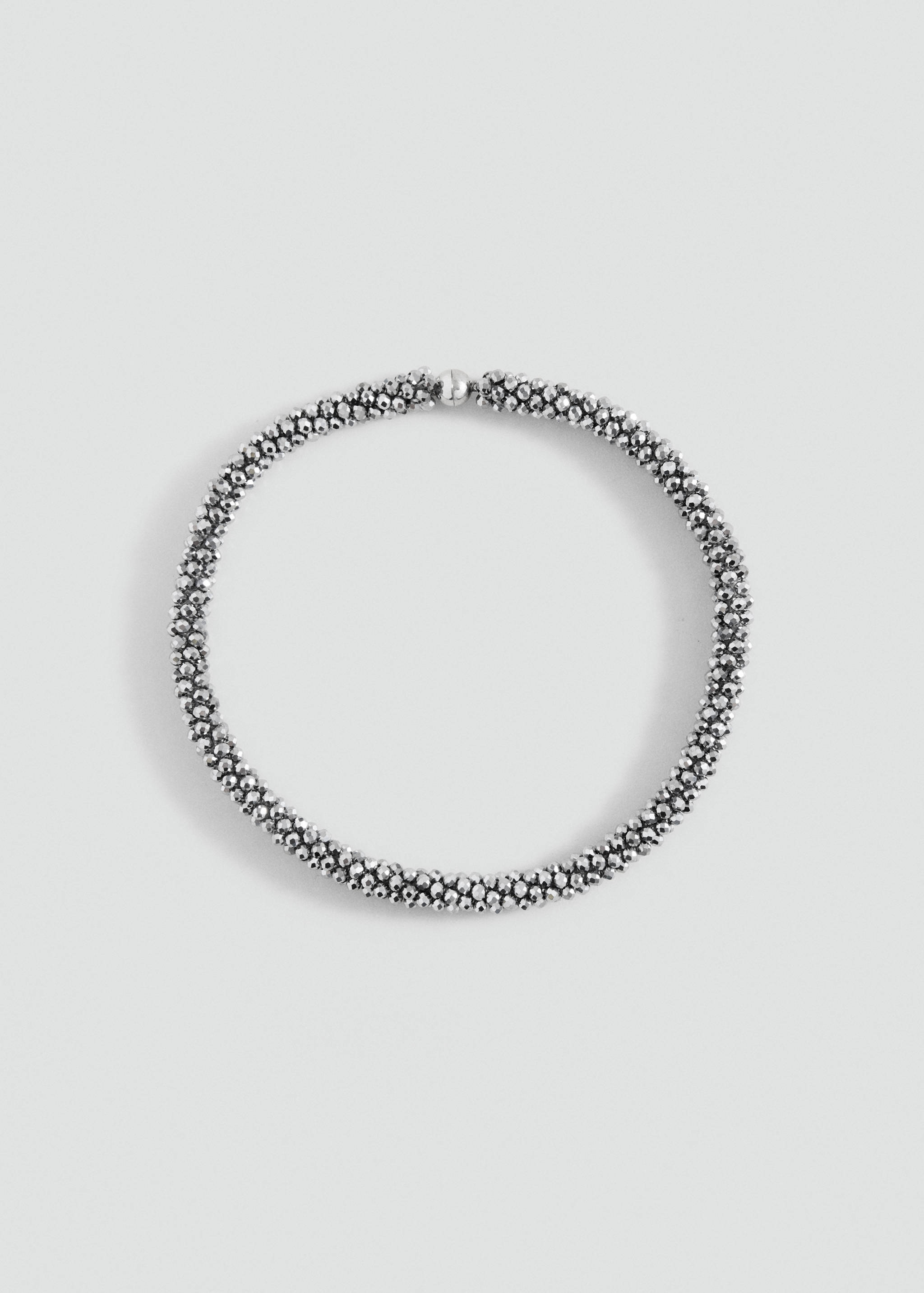 Silver-toned beaded collar necklace with a textured metallic finish.