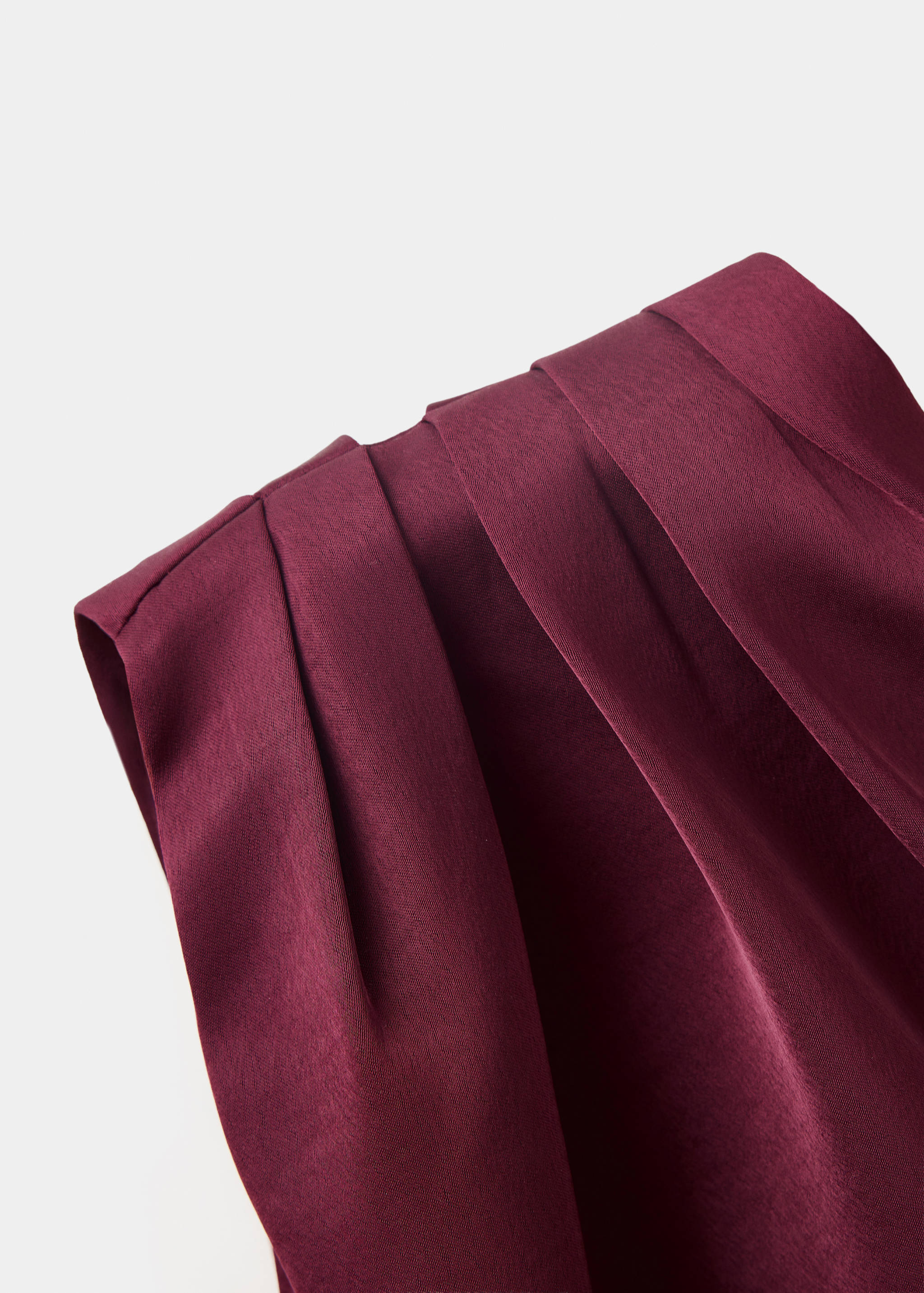 Burgundy blouse detail, showing pleated shoulder.