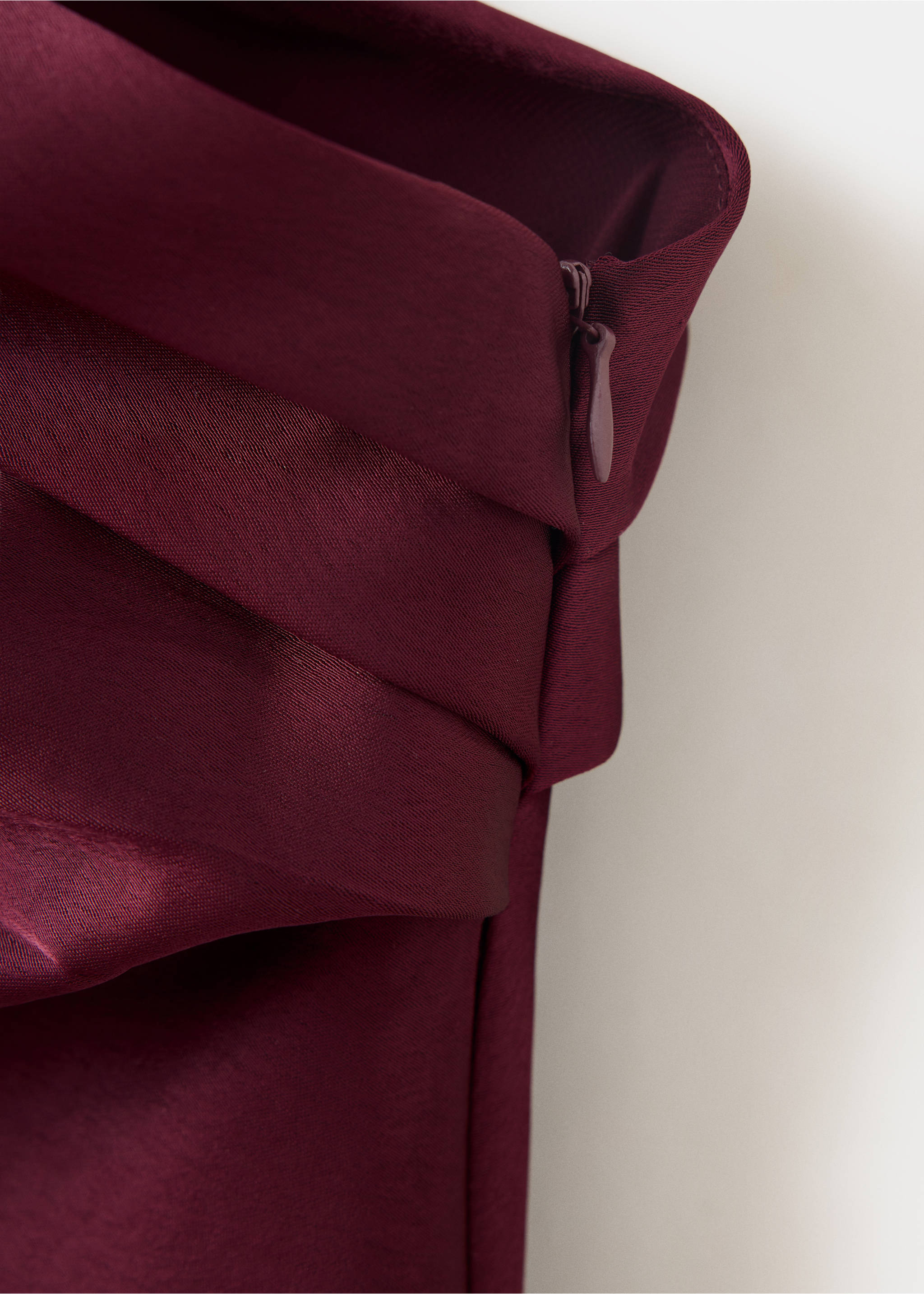 Close-up of the fabric and side zip on a burgundy satin blouse., Burgundy. Ref: 37069129-00.
