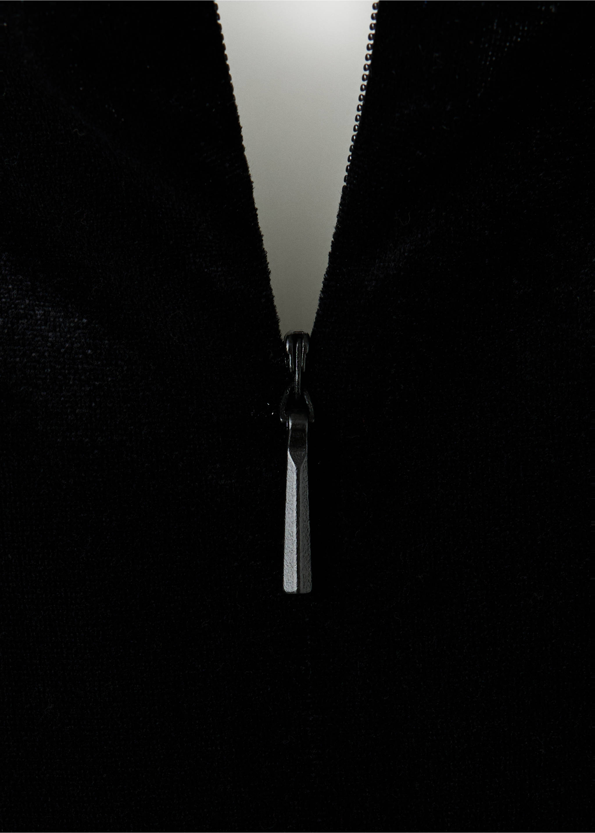 Close-up of a black jumpsuit zipper detail., Black. Ref: 37069131-00.