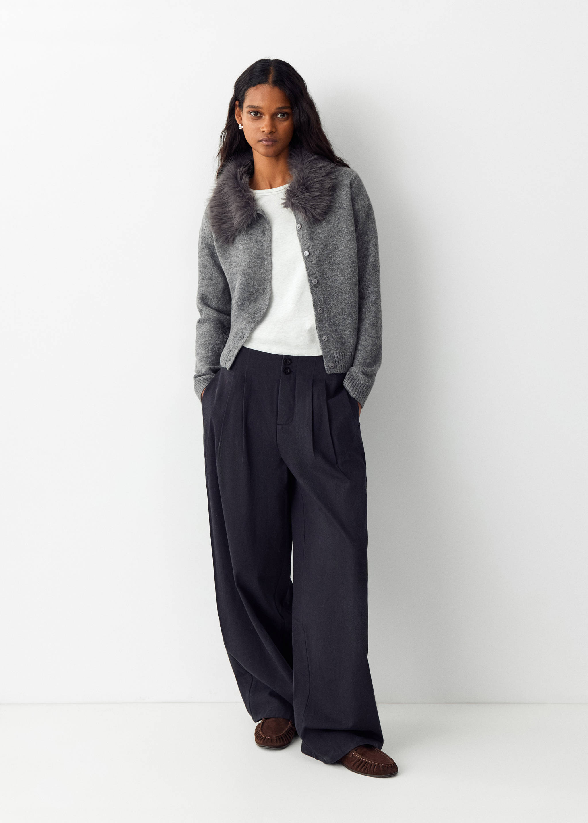 Grey knit cardigan with a dark grey faux-fur collar, button fastening, and ribbed trims.