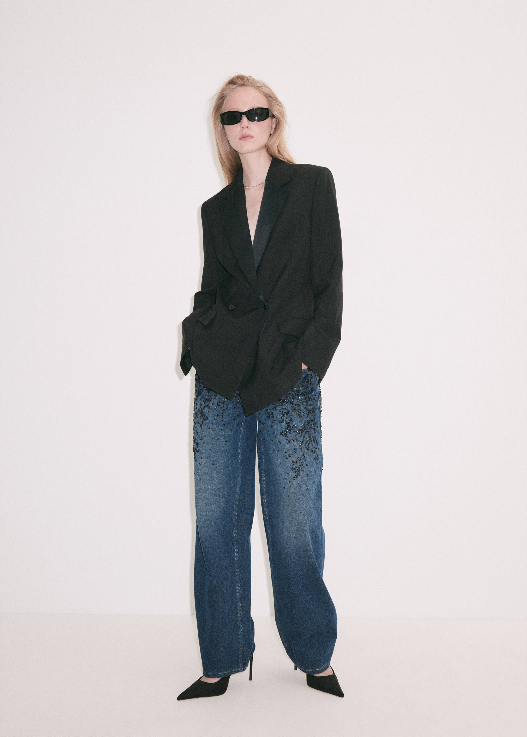 Dark blue denim trousers featuring black beaded embroidery, worn with a black blazer., Dark Blue. Ref: 37069137-00.