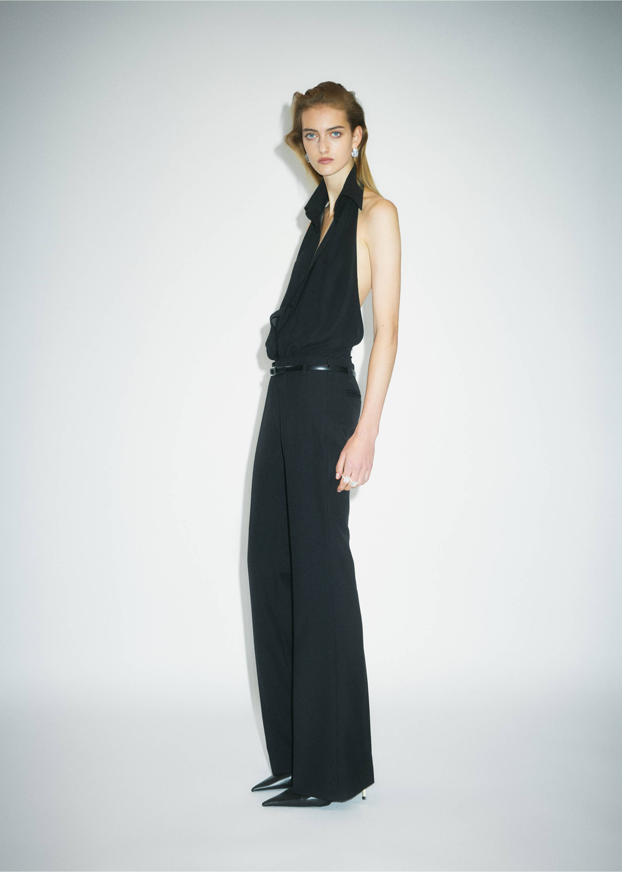 Thin black belt worn with an all-black halter top and trousers., Black. Ref: 37069138-00.