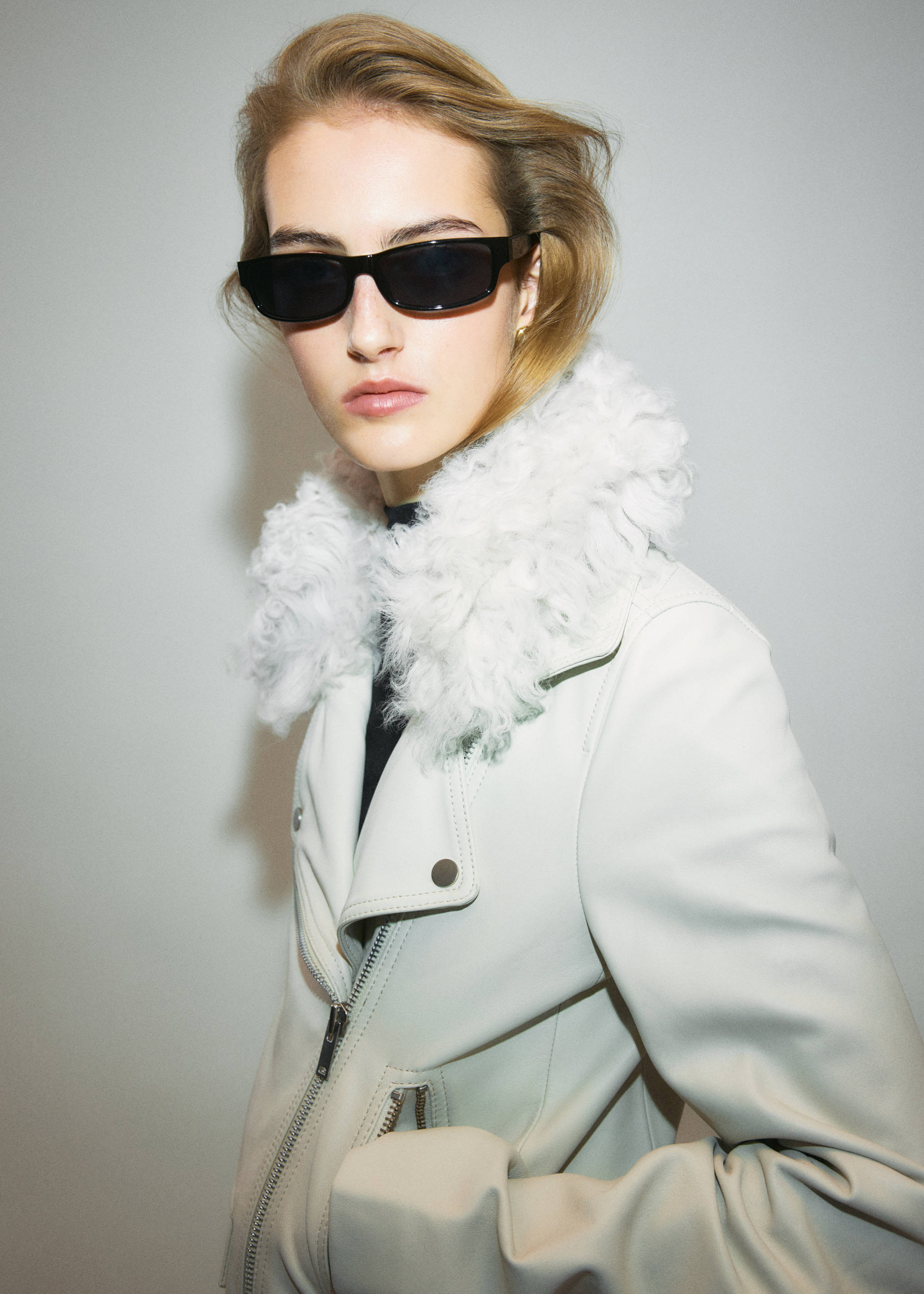 Light grey jacket with a white faux-shearling collar.