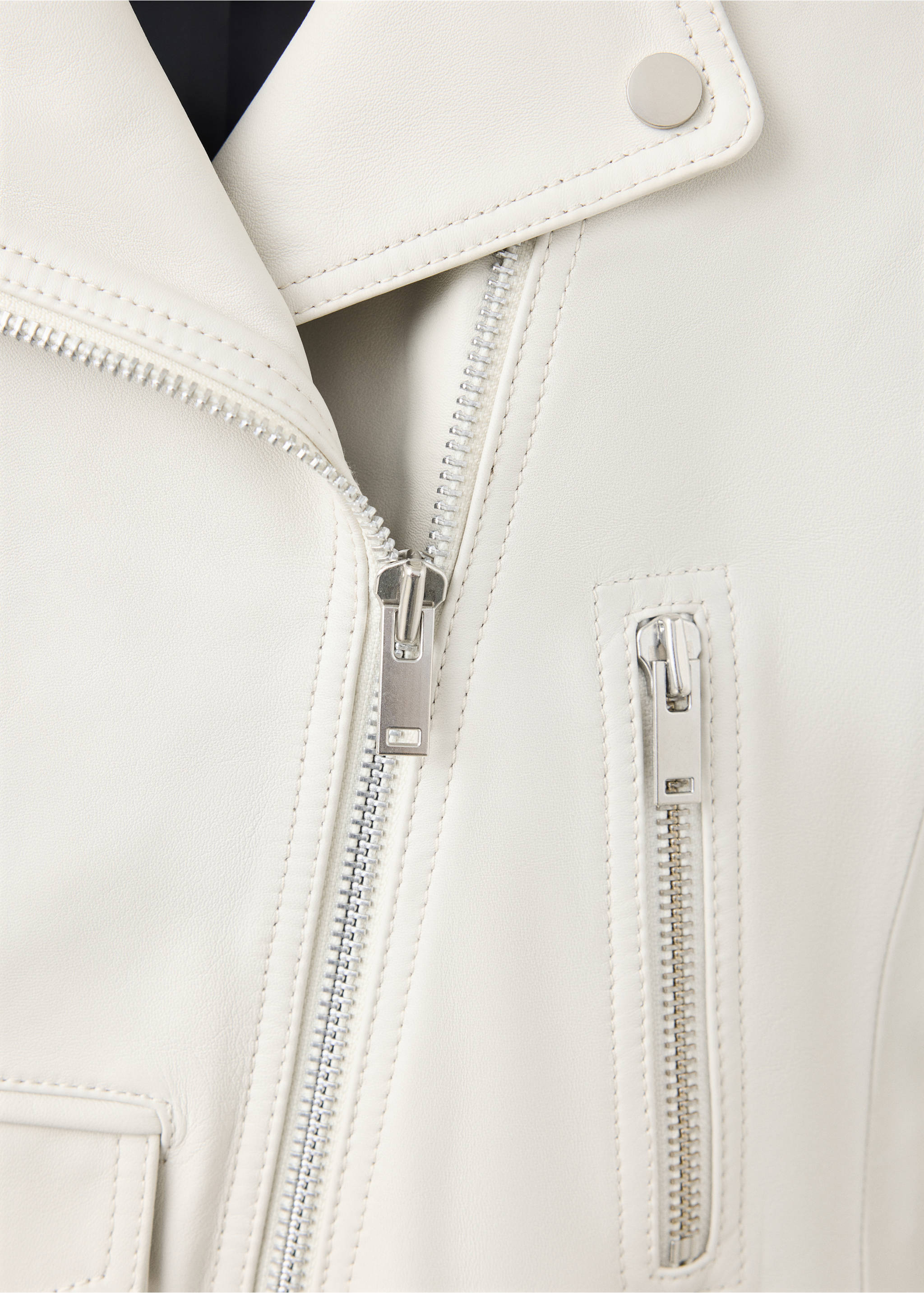 Close-up of an off-white leather biker jacket with silver zips., White. Ref: 37069141-00.