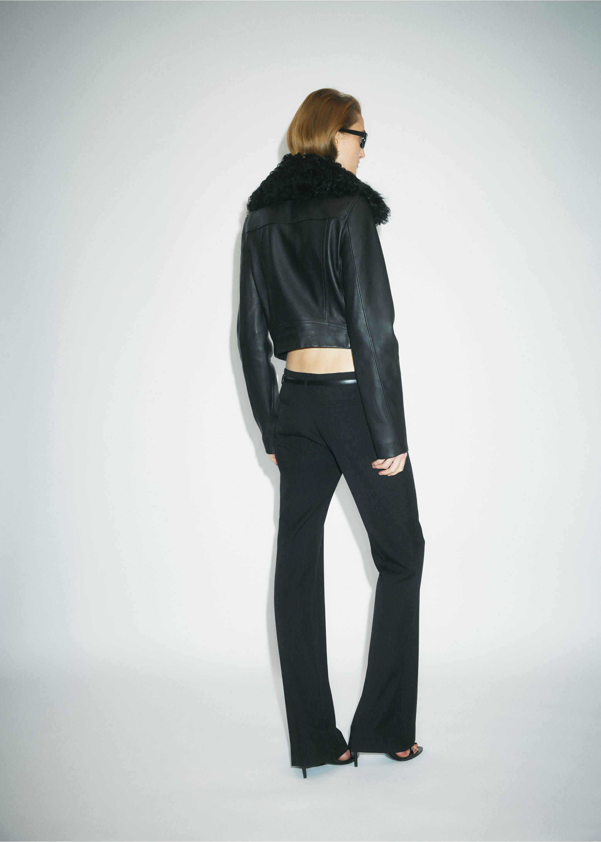 Black leather jacket with textured faux-fur collar, back view., Black. Ref: 37069141-00.