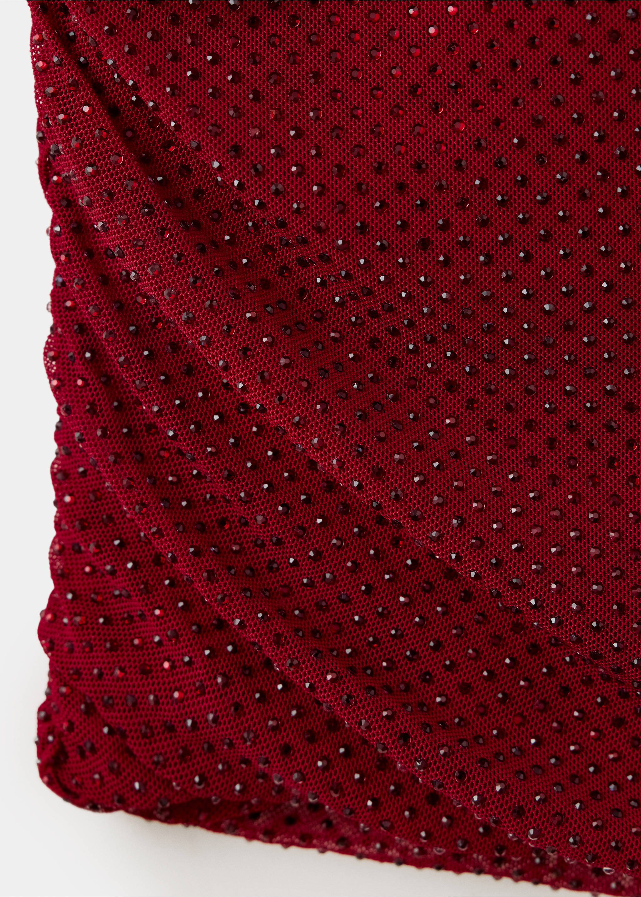 Close-up of the red dress fabric with rhinestone embellishments., Red. Ref: 37069144-00.