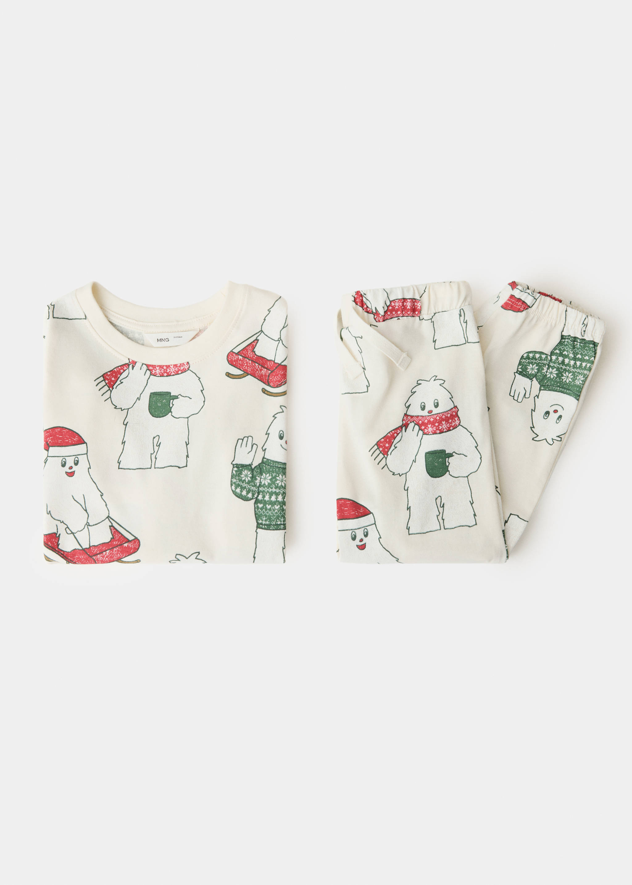 Children's festive yeti-print pyjama set featuring a long-sleeved top and trousers.