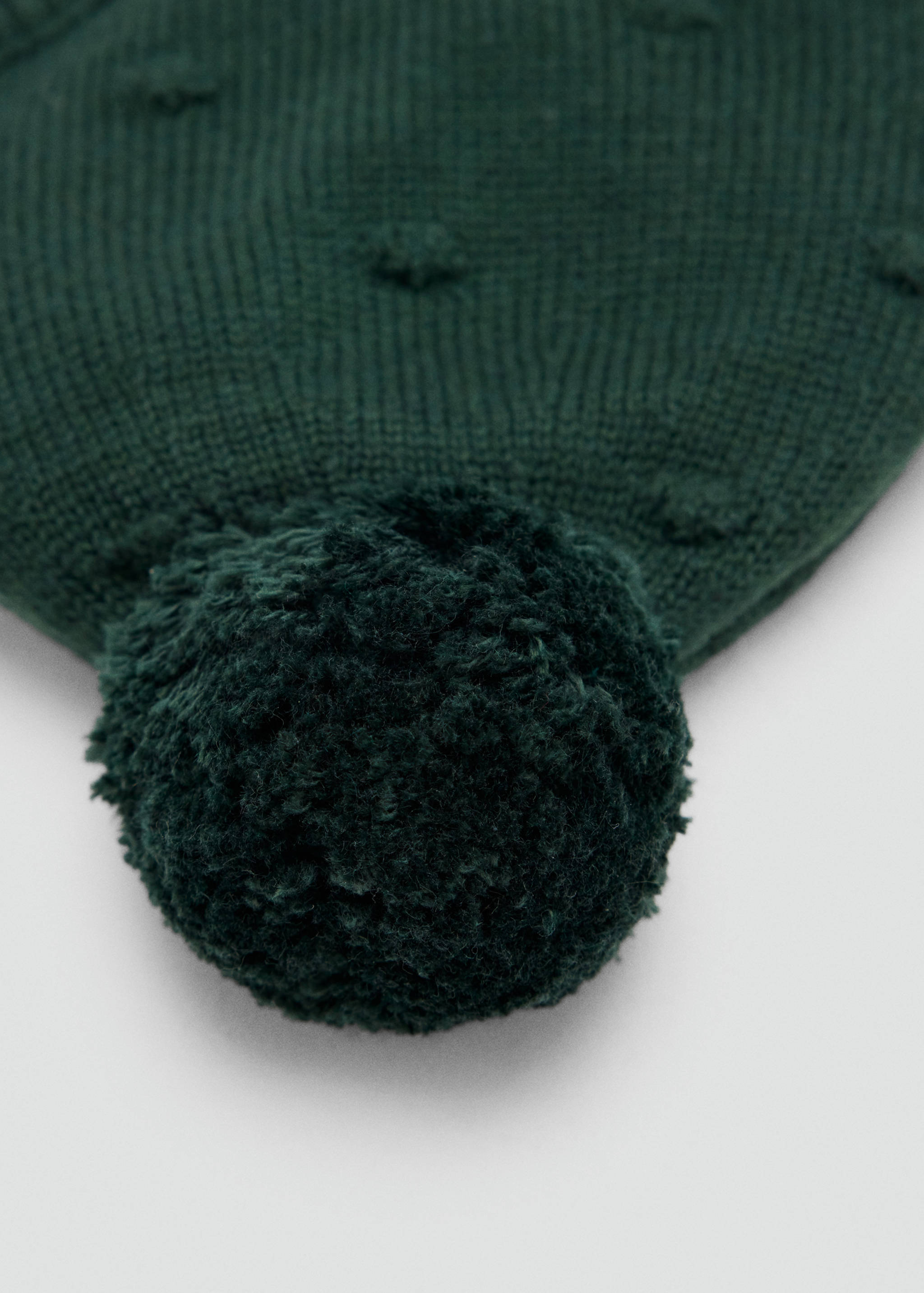 Dark green children's knit hat with a pom-pom and bobble detail.