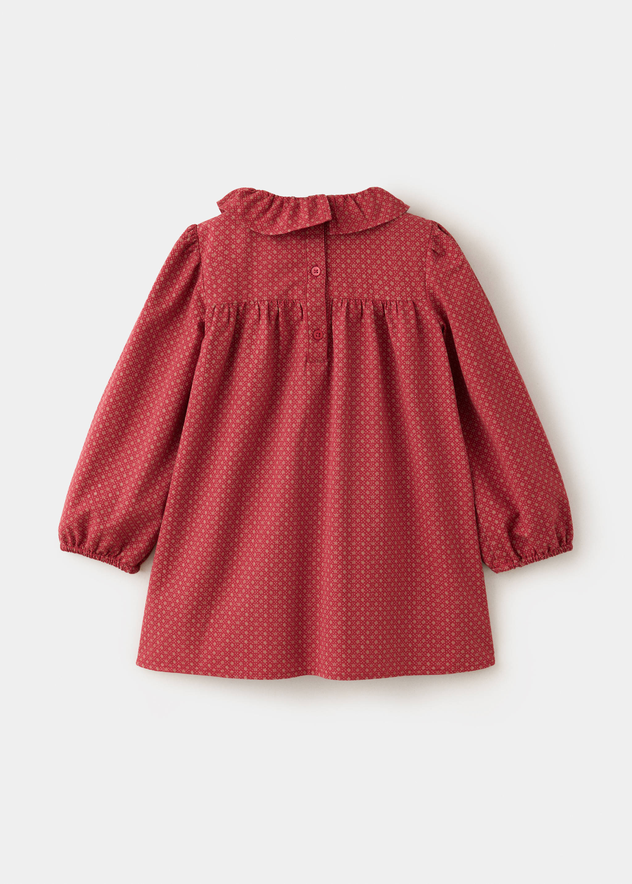 Red patterned kids' dress seen from the back, featuring a ruffled collar and buttoned placket.
