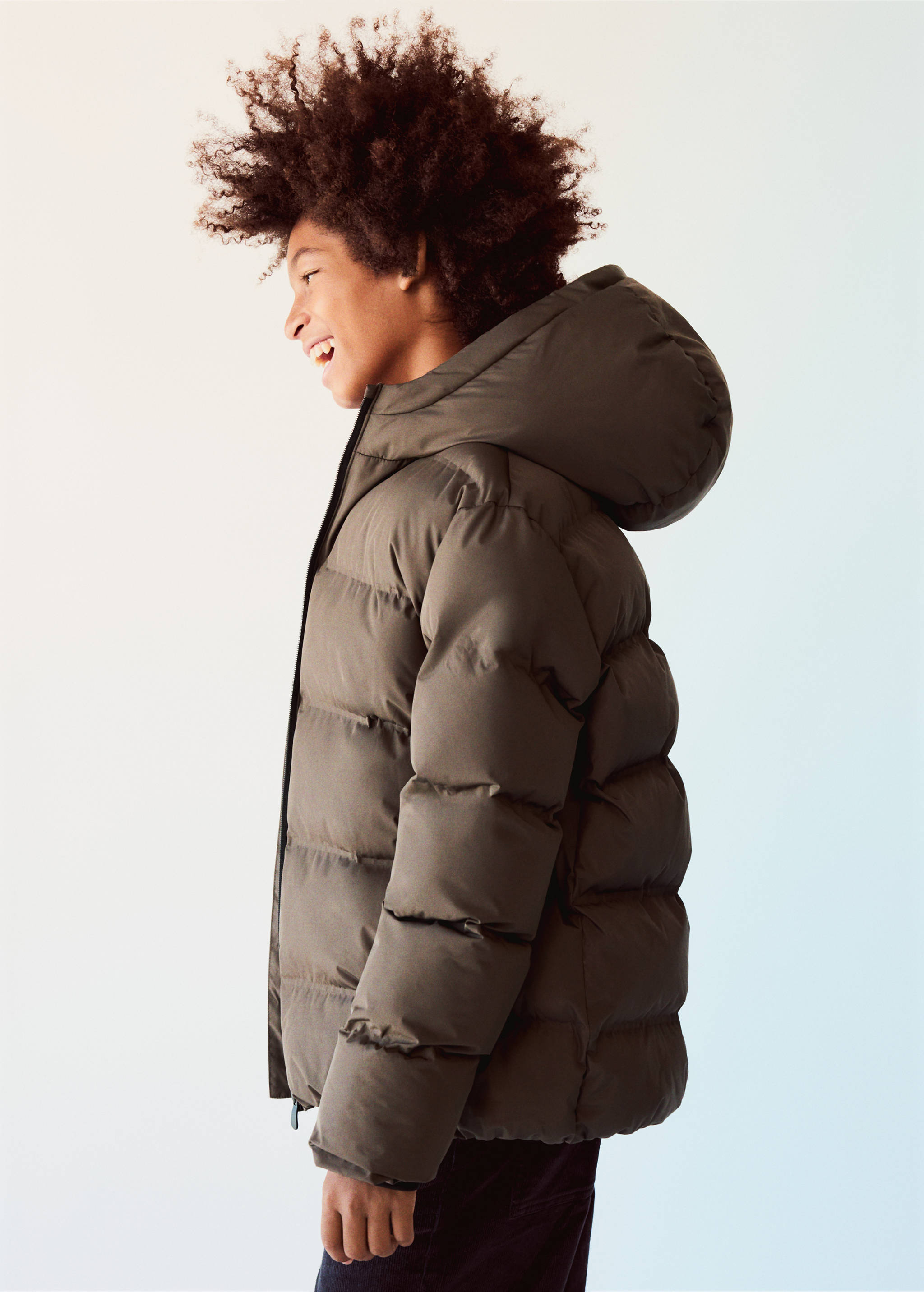 Dark olive green quilted anorak with a large hood and a padded silhouette.