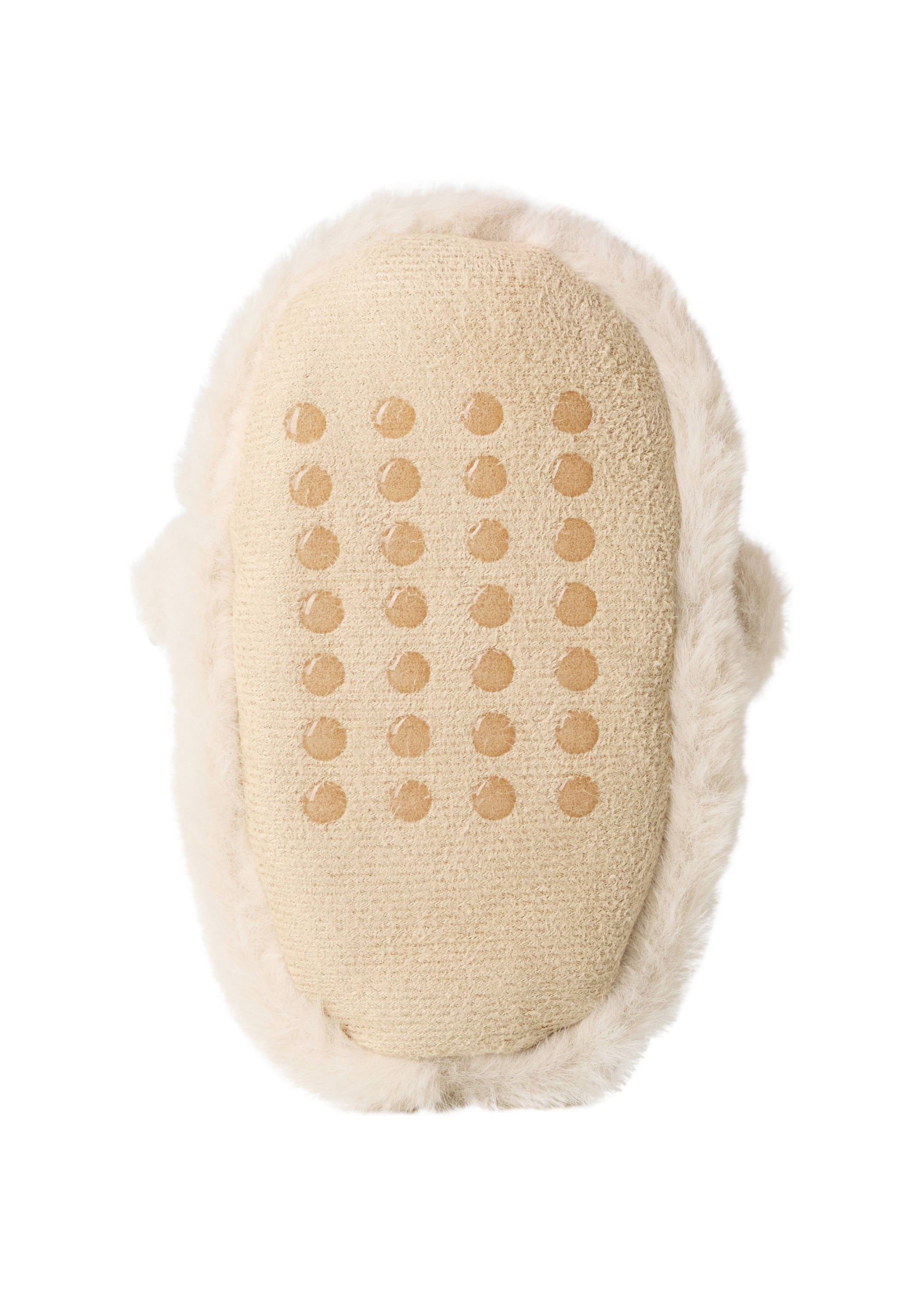 Close-up of a cream home slipper sole with anti-slip rubber grips.