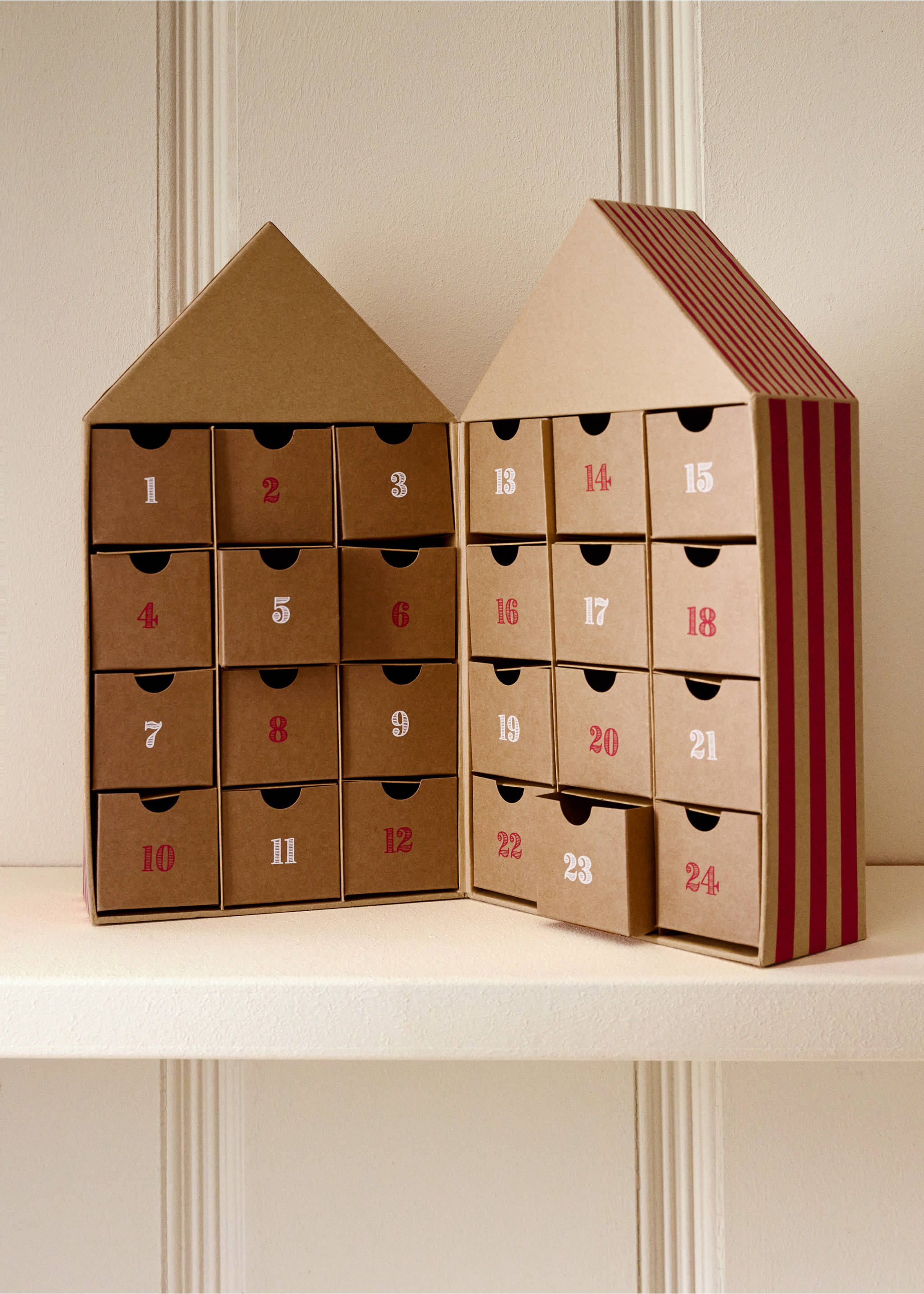 House-shaped cardboard advent calendar with numbered drawers and red stripes., Brown. Ref: 37071539-00.
