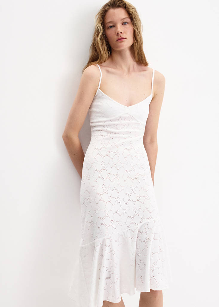 Dress with openwork embroidery and flounce