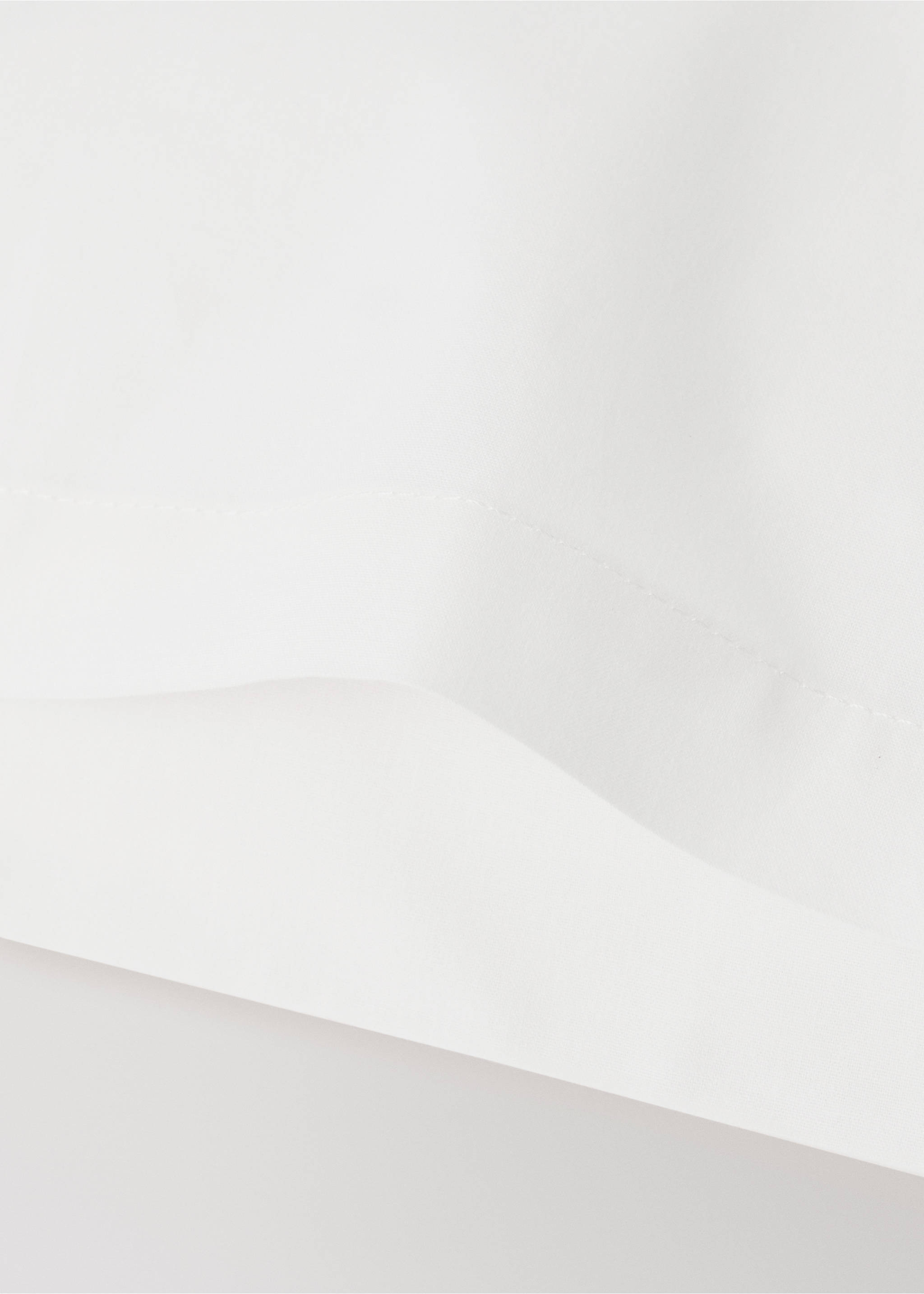 Close-up of a white cot pillowcase showing fabric texture and seams., Medium Brown. Ref: 37072559-00.