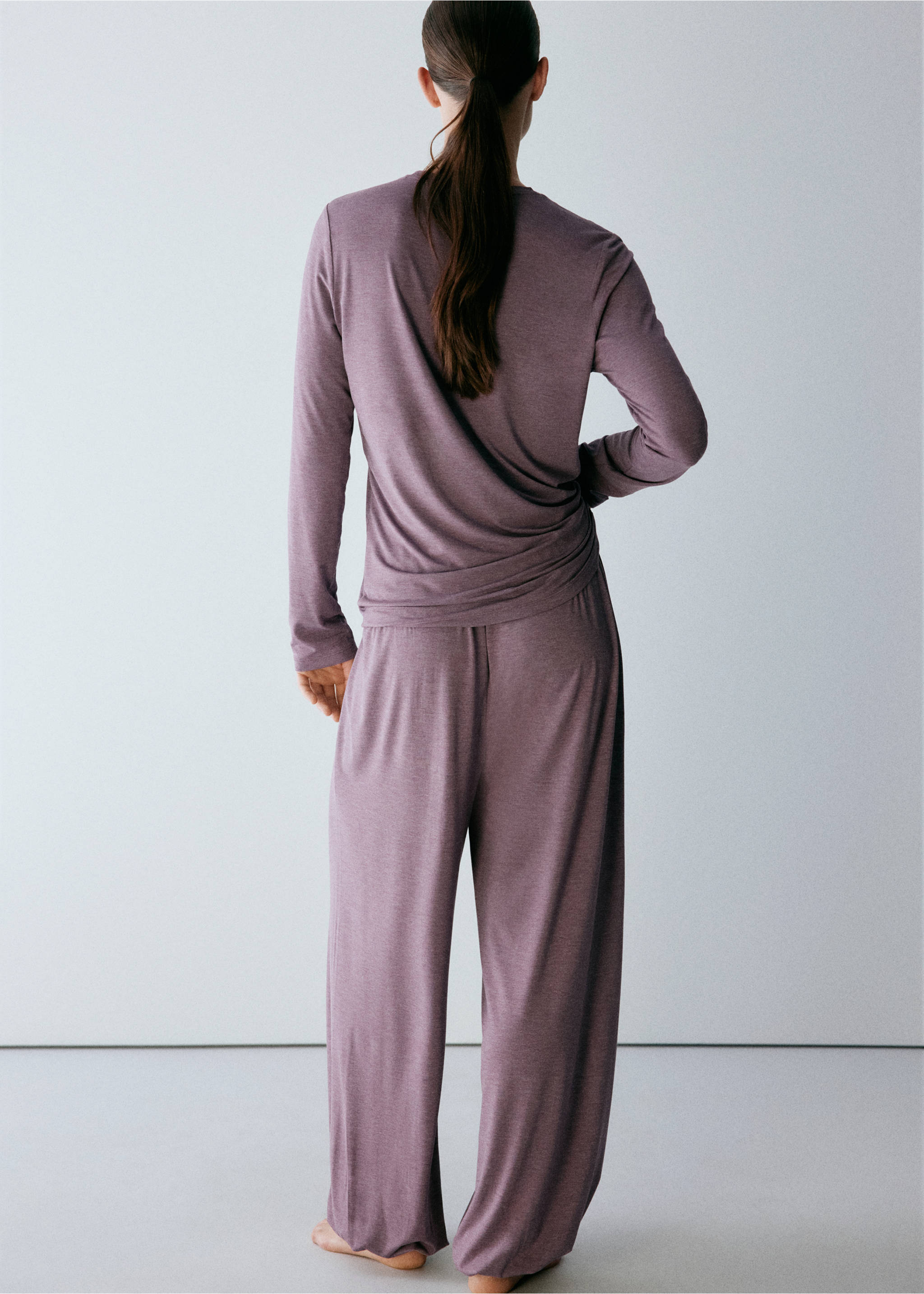 Back view of a mauve long-sleeved pyjama t-shirt worn with matching trousers., Purple. Ref: 37072921-00.