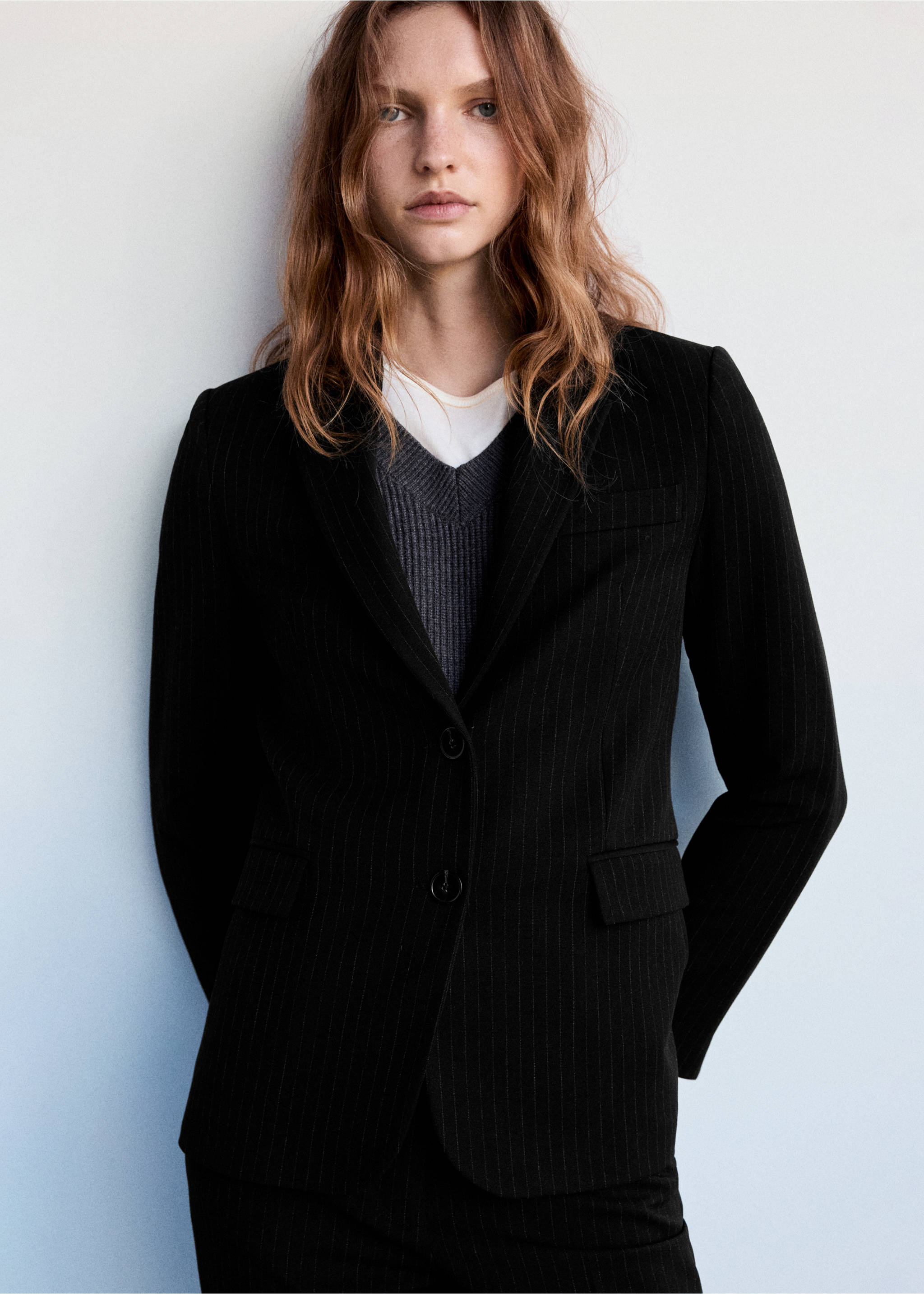 Black pinstripe blazer with a tailored fit, lapels, and two front buttons., Black. Ref: 37074111-00.
