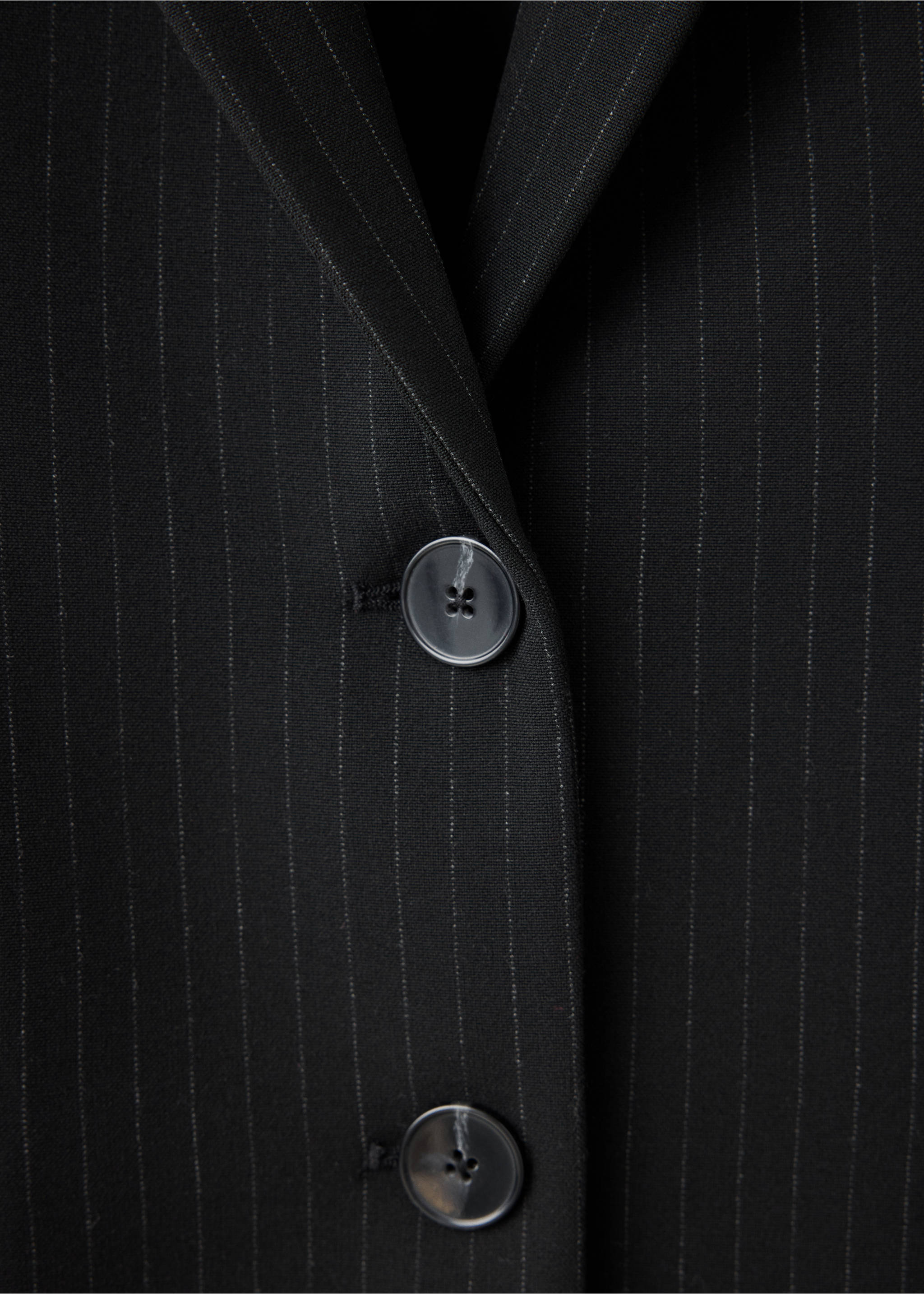 Close-up of a black pinstripe blazer with buttons., Black. Ref: 37074111-00.